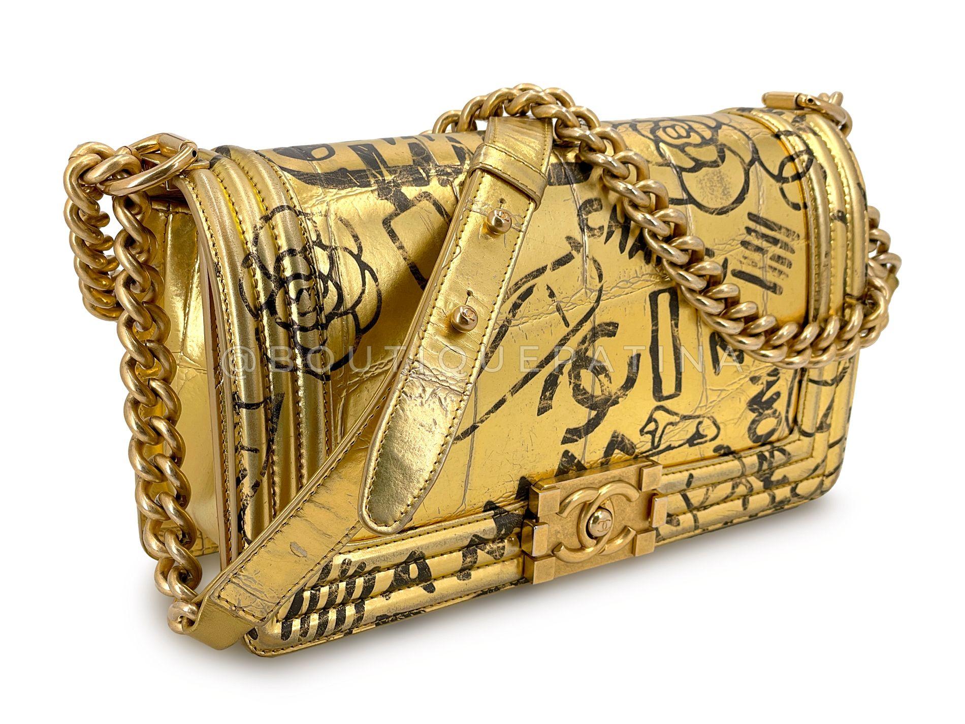 Store item: 68578
Chanel 19A Egypt Gold Crocodile Print Graffiti Boy Bag Medium GHW Paris-New York in the classic 10 inch medium boy flap is a great combination of bold and stylish. 

The graffiti pieces in this collection were a combination of