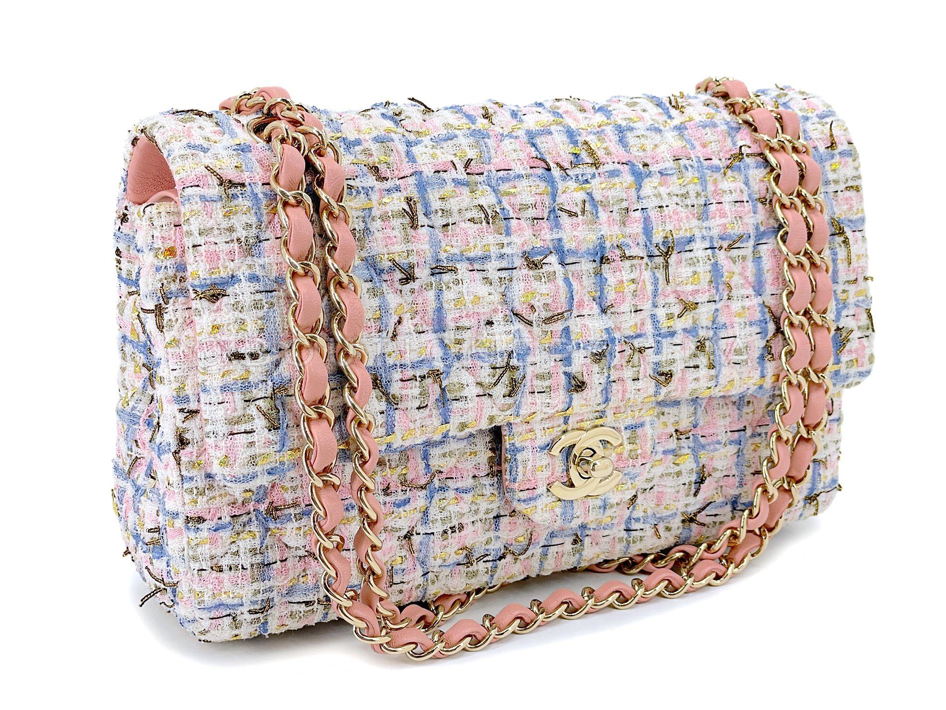 Store item: 68176
This Chanel 19C Pink Tweed Boucle Medium Classic Double Flap Bag GHW is from Karl Lagerfeld's monumental nautical-themed 2019 Resort collection. 

Intricate bright-colored boucle tweed fibers that is so very quintessential Coco