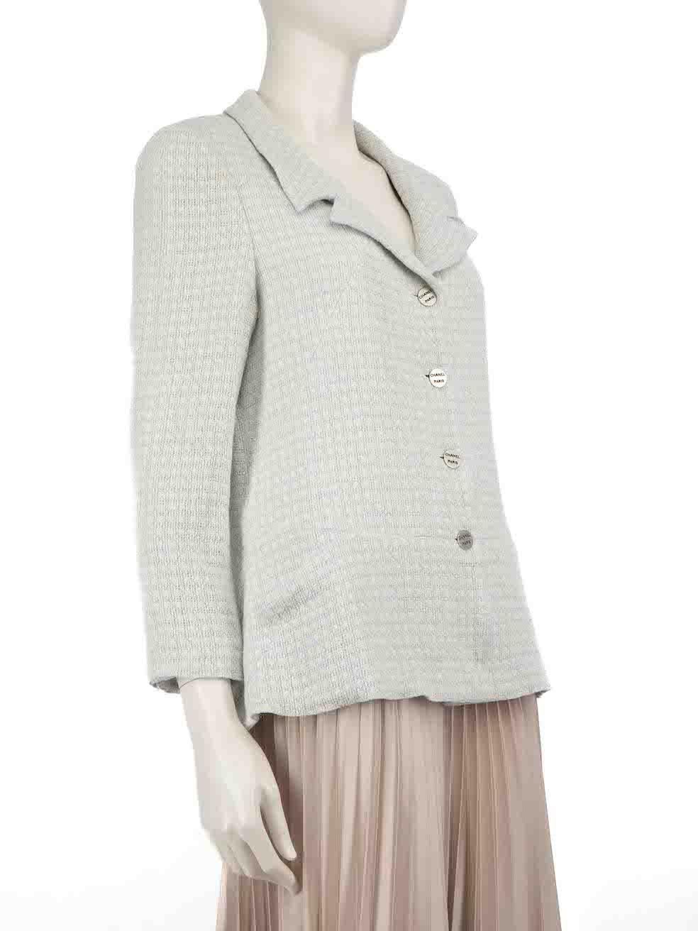 CONDITION is Very good. Minimal wear to jacket is evident. Light stain on the upper right sleeve on this used Chanel designer resale item.
 
 Details
 2000
 Blue
 Wool tweed
 Jacket
 Button up fastening
 Logo buttons
 Long sleeves
 Buttoned cuffs
