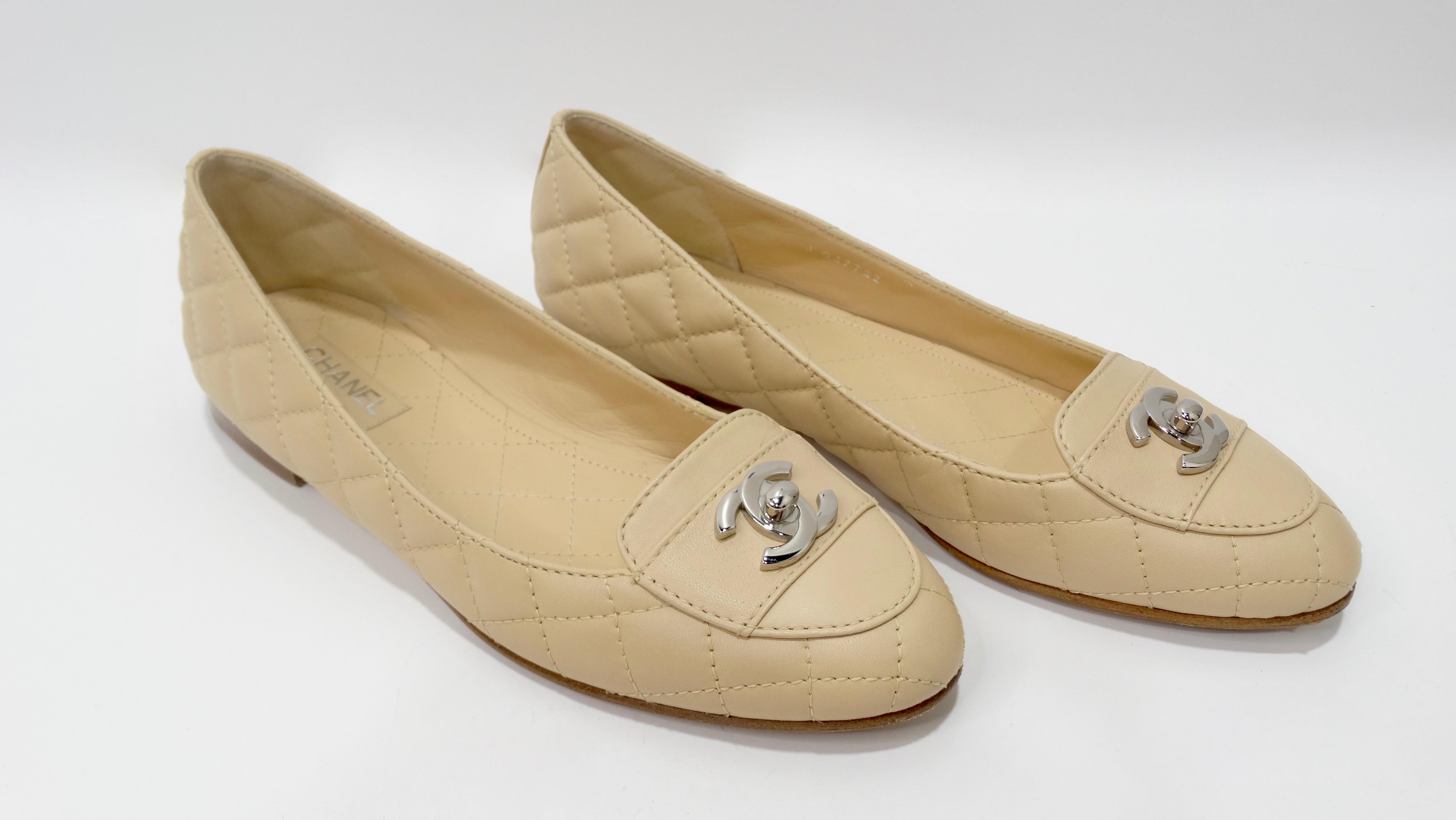 For every Chanel lover! Circa 2000s, these adorable flats are crafted from soft beige leather and feature Chanel's signature quilted stitching, a wood heel and a silver toned CC turn lock at the upper. Insoles feature quilted stitching. Classic and
