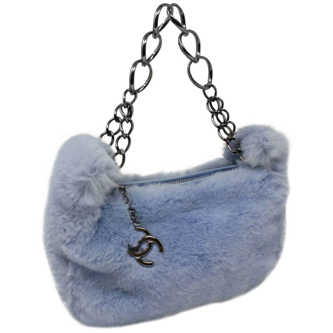The 2000s called and they have your dream bag in stock! This Y2K GEM is crafted in ice blue rex fur, with ruthenium hardware, a funky single chain-link shoulder strap that will pair nicely with accessories, the most perfect CC charm, the top zipper