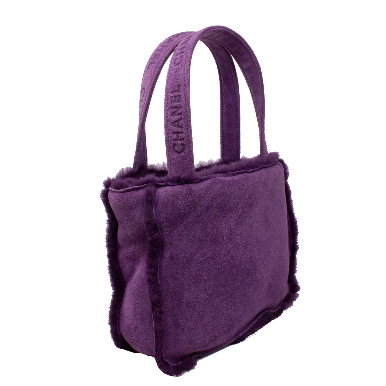 Very spirited mini Chanel tote crafted in soft purple shearling, with two logo printed Chanel handles, the open top opens up to a single zippered pocket and a slip pocket. We love how darling and cute this vintage piece is!

SPECIFICS
Length: