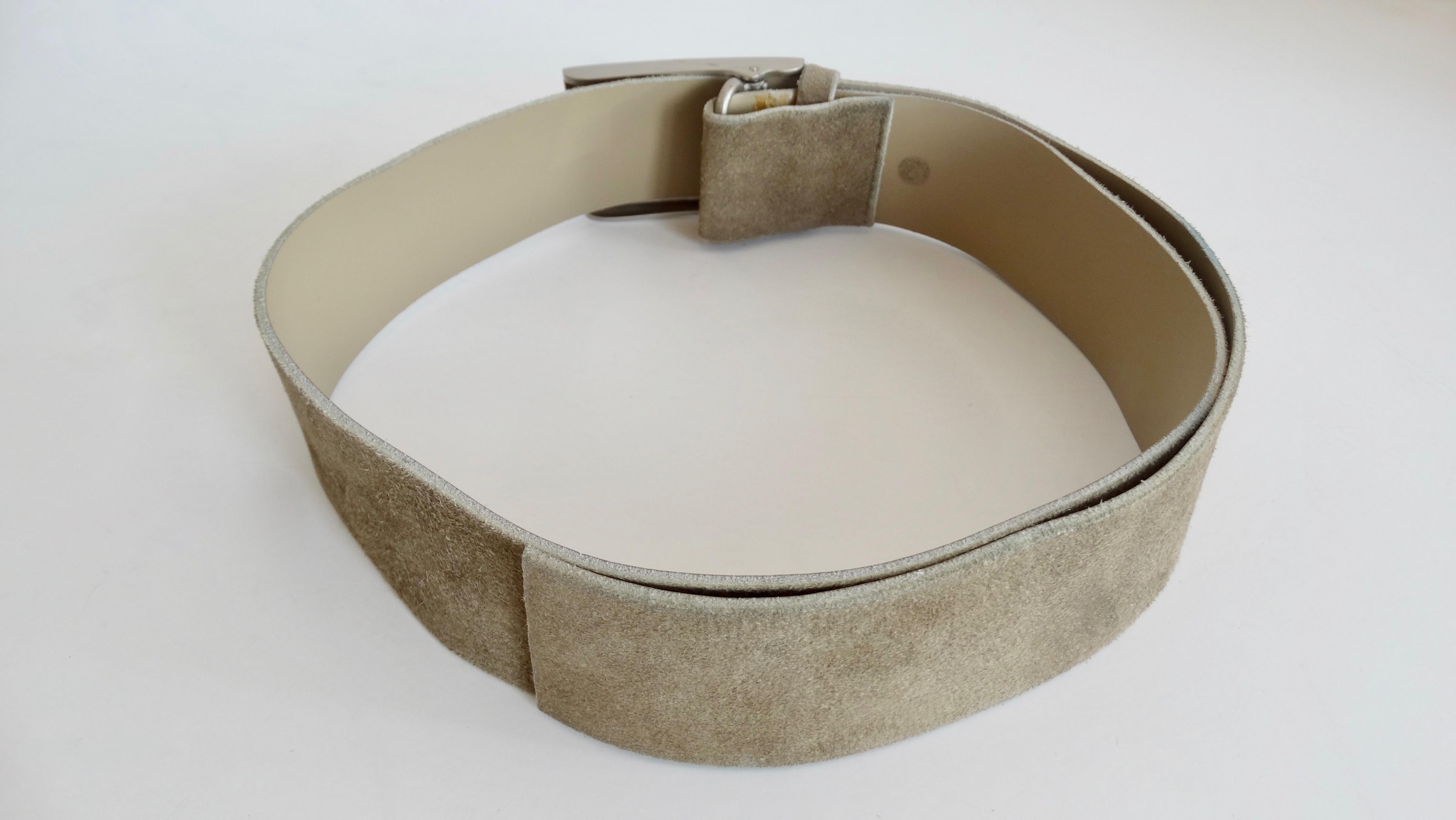 Everyone needs a belt that can go with nearly every thing! Circa early 2000s, this Chanel belt is made of sage colored suede and features a metal buckle stamped 