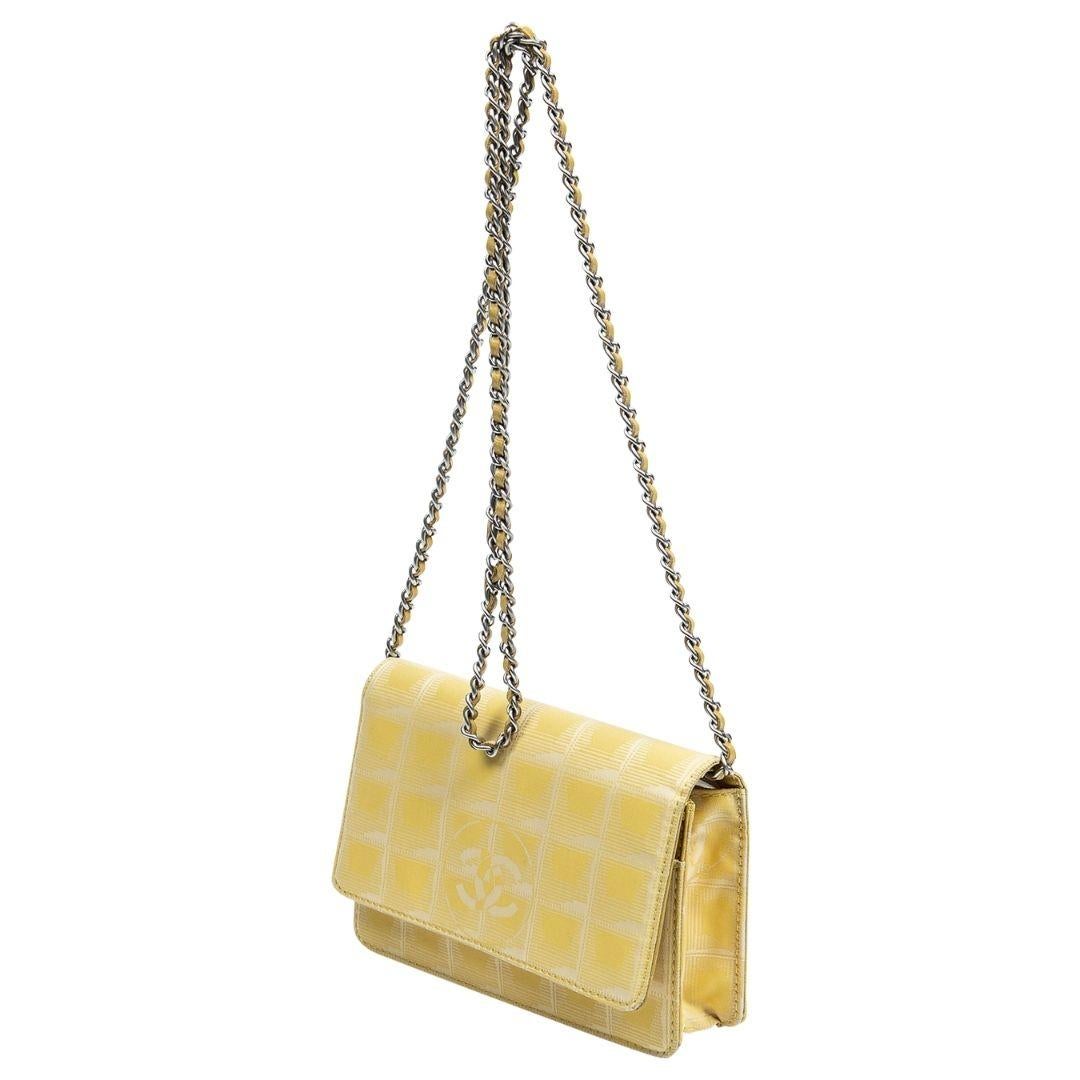 The ultimate summer grab and go! This beauty is crafted in a stunning yellow logo Jacquard canvas and a long classic Chanel leather interwoven chain. We love that there is a zippered pocket to the back as you can put your ID there or other items.