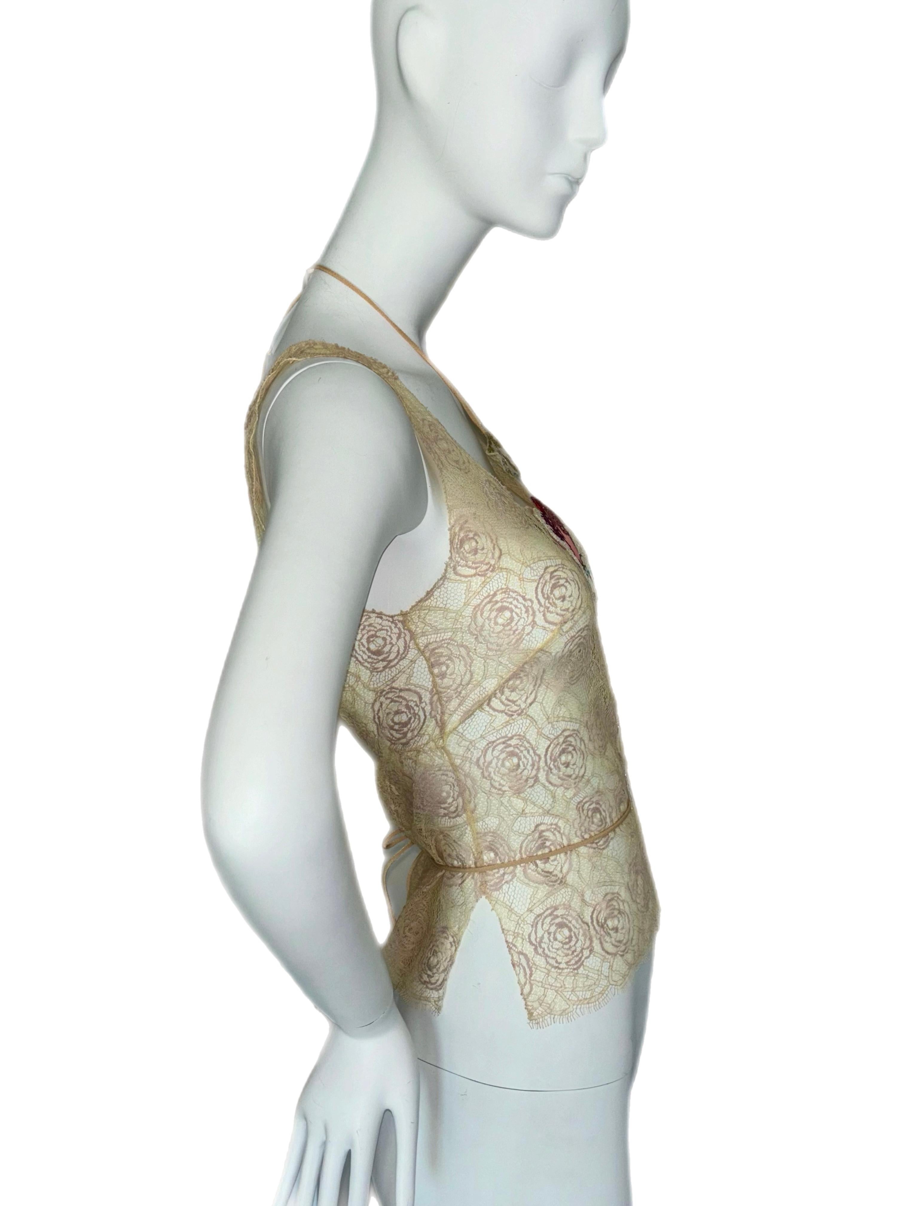 Chanel
Cruise 2004
Vintage
Sheer lace
Pristine
FR38
Pristine, any marks are not on the blouse, they are on my mannequin peeking through. Minimal stretch

Measurements in inches laying flat: pit to pit 15, length from top strap to bottom hem 21,