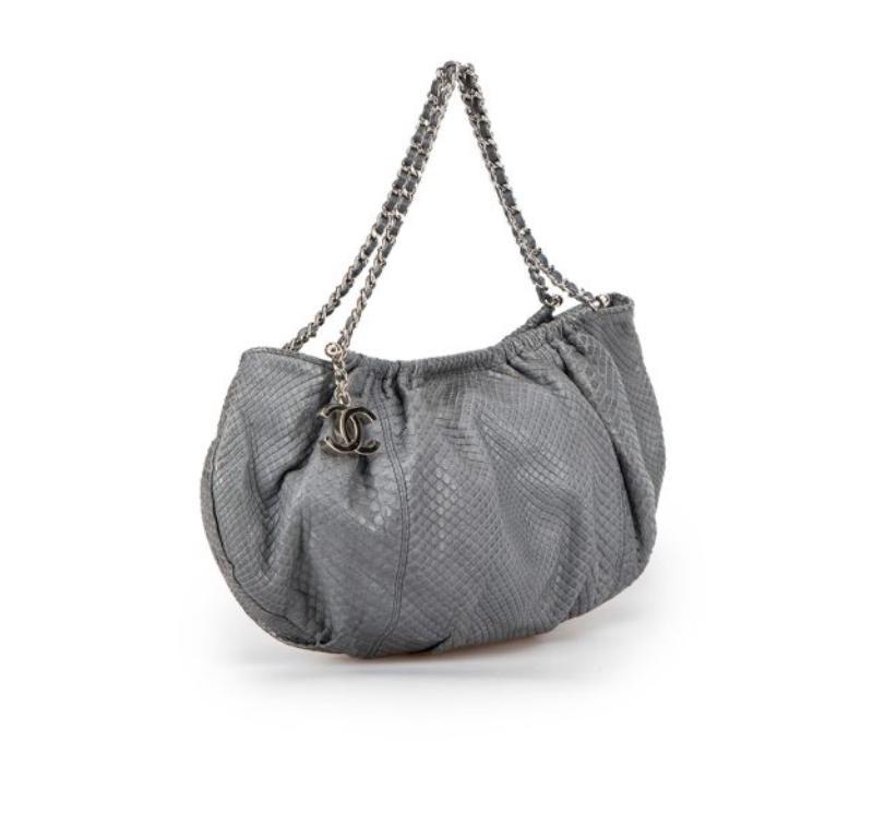 CONDITION is Very good. Minimal wear to bagis evident. Minimal wear to the rear with dark marks to the scales on this used Chanel designer resale item. This item comes with original dust bag.
 
 
 
 Details
 
 
 2005 - 2006
 
 Vintage
 
 Grey
 
