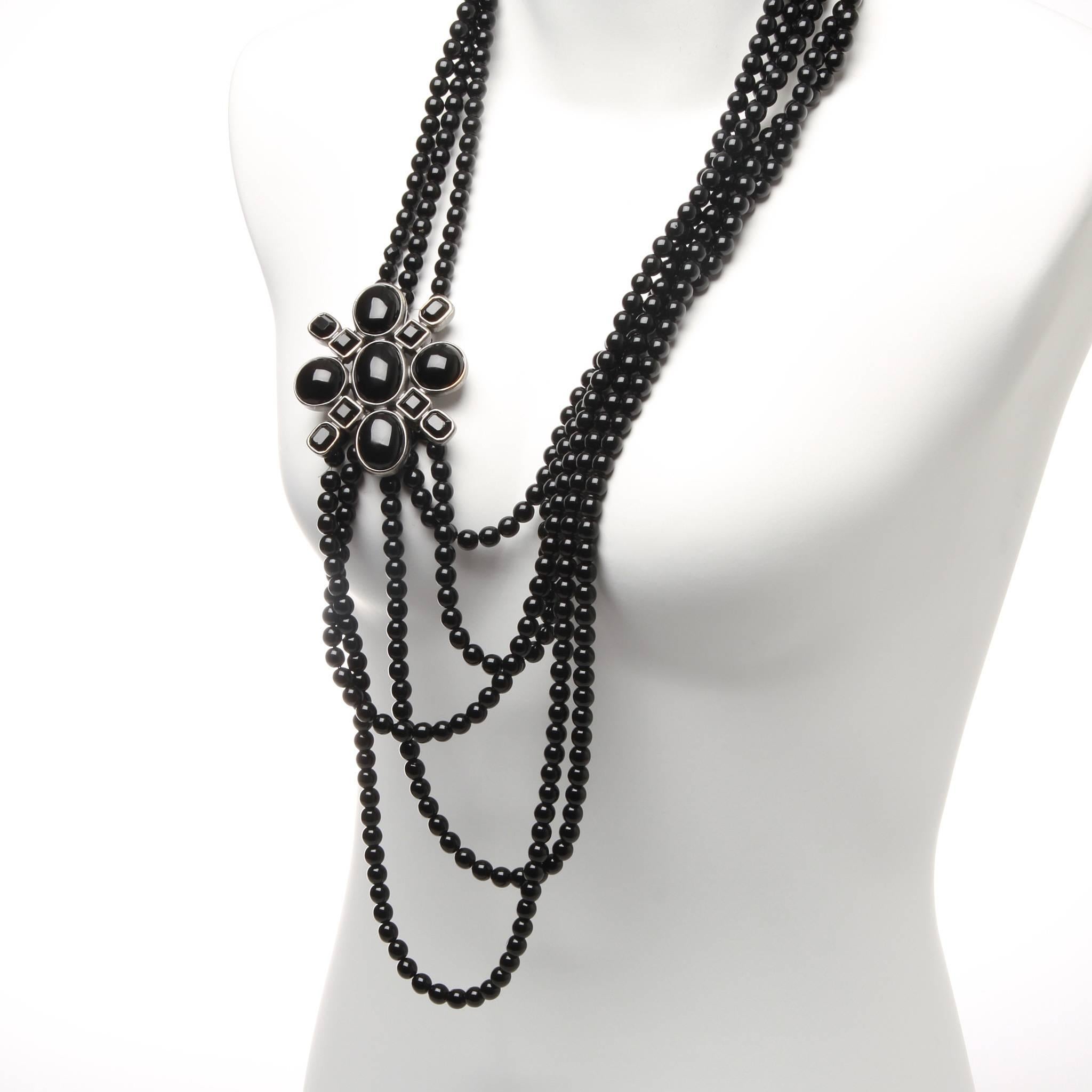 FINAL SALE

CHANEL Black Multi-Strand Beaded Necklace With Flower Charm

Age: 2005
Made In France
Materials: Beads, Resin, Silvertone Hardware.
Features Three Draped Beaded Strands With A Jeweled Flower Pin Accent. Other Side Of Flower Has Five