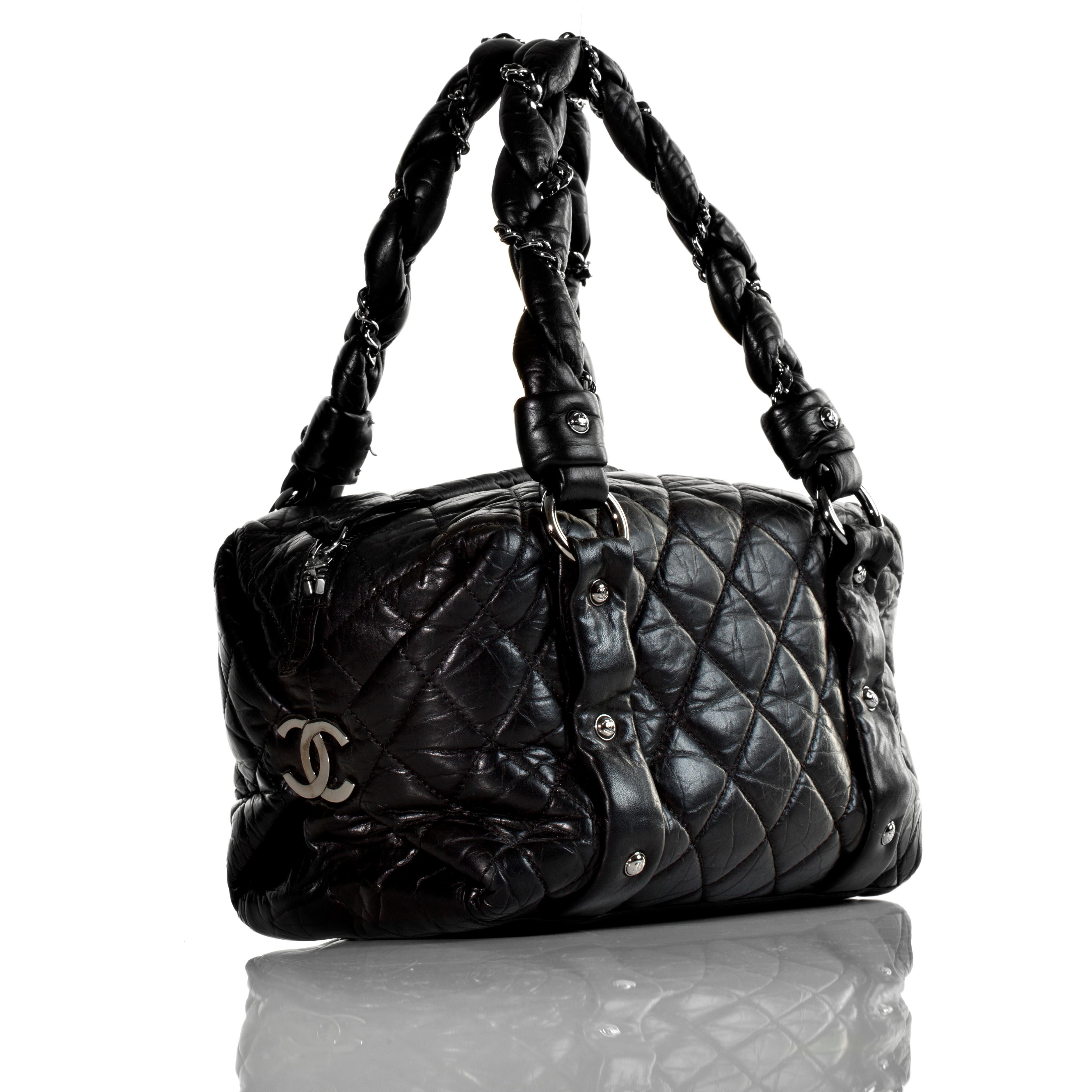Chanel 2006 Distressed Soft Bubble Calfskin Small Mini Bowler Tote 

Small size Chanel distressed calfskin black bowler with interwoven braided straps

2006 {VINTAGE 16 Years}
Silver hardware
Zipper closure
Interior graffiti lining
Interior centered