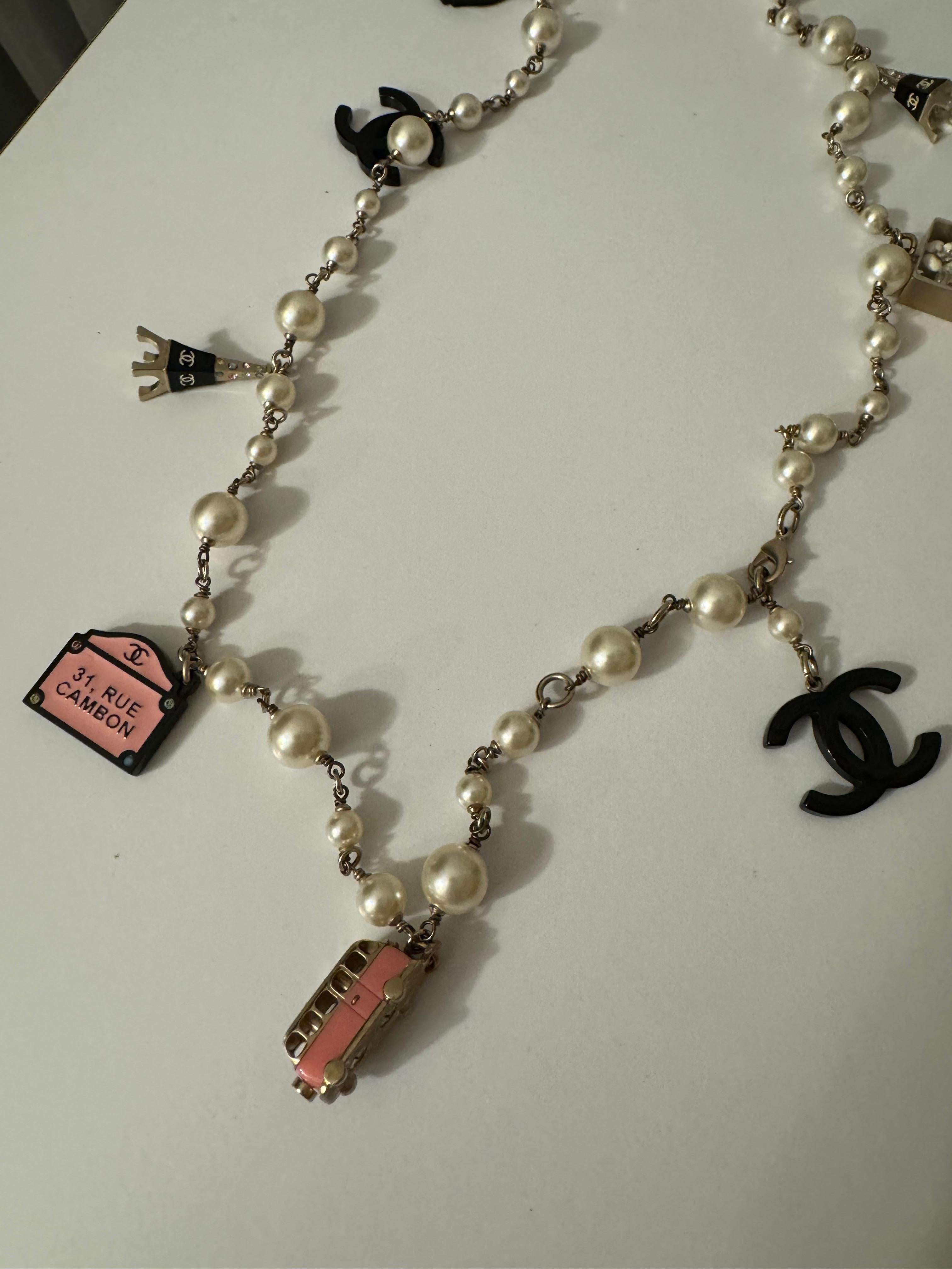 Chanel Gold Metal, Pink, Black, White Resin, Enamel, Strass, and Imitation Paris Souvenir Charm Necklace, 2006

like new

Dimensions

Height: 17.5 inches / 44.45 cm
Width: 0.39 inches / 1 cm
Depth: 0.39 inches / 1 cm
