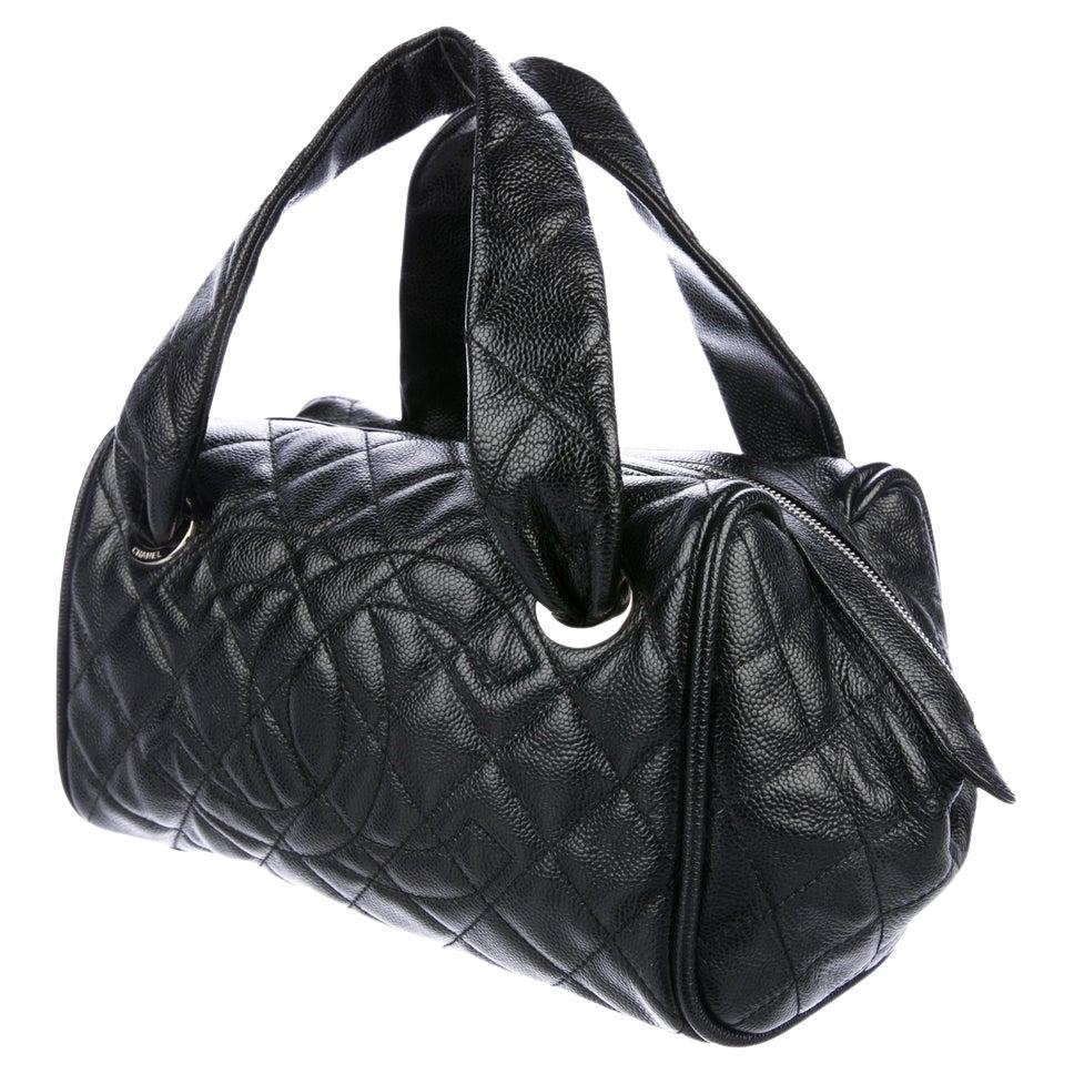 Chanel 2006 Quilted Caviar CC Kelly Top Handle Boston Small Satchel Tote Bag 

Year: 2006 {Vintage 18 Year}

Silver hardware
Stitched CC Logo at front 
Dual top handles
Zip closure at top
Black leather lining 
Three interior pockets
Protective feet