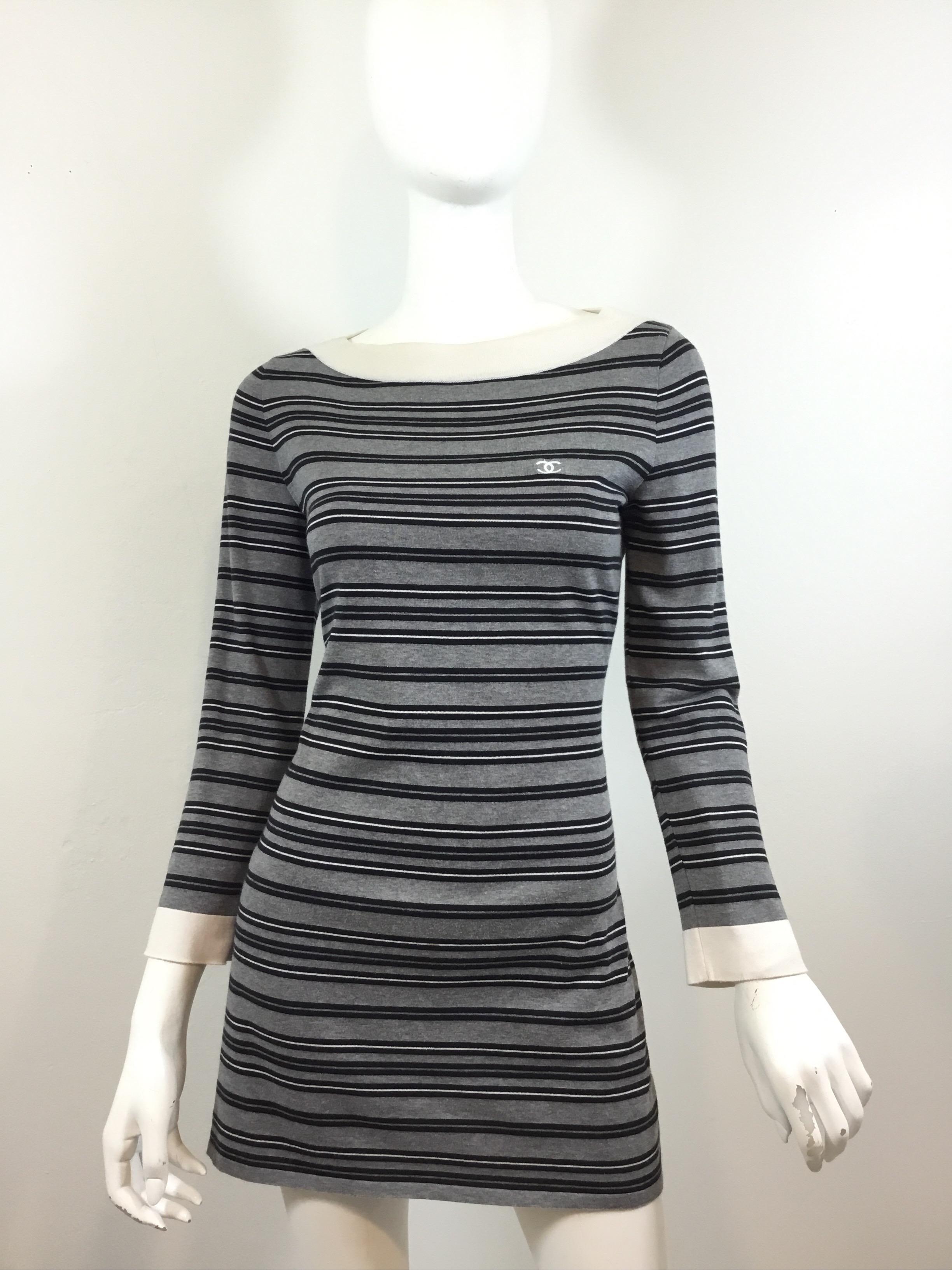 Chanel grey/black/white/cream striped knit tunic, boatneck style, 100% cotton, size 42 and made in France. Tunic also has an embroidered CC logo on the left bust.

Bust 36'', waist 33'', hips 36'', sleeves 23'', length 30''