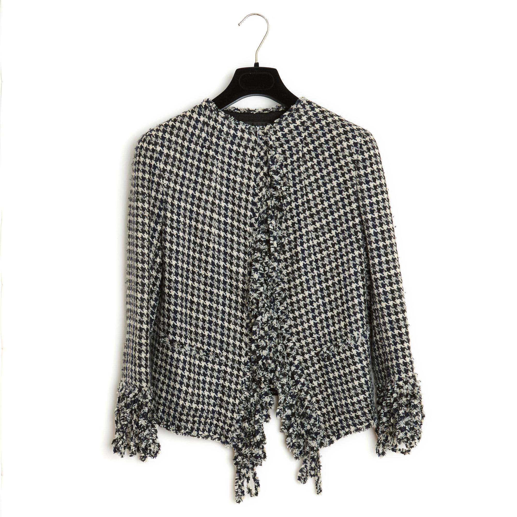Chanel Spring Summer 2007 collection jacket in black and ecru houndstooth patterned silk and wool braid, round collar edged with fringes along the entire length and around the bottom of the jacket, 2 patch pockets at the waist, 3/4 sleeves also