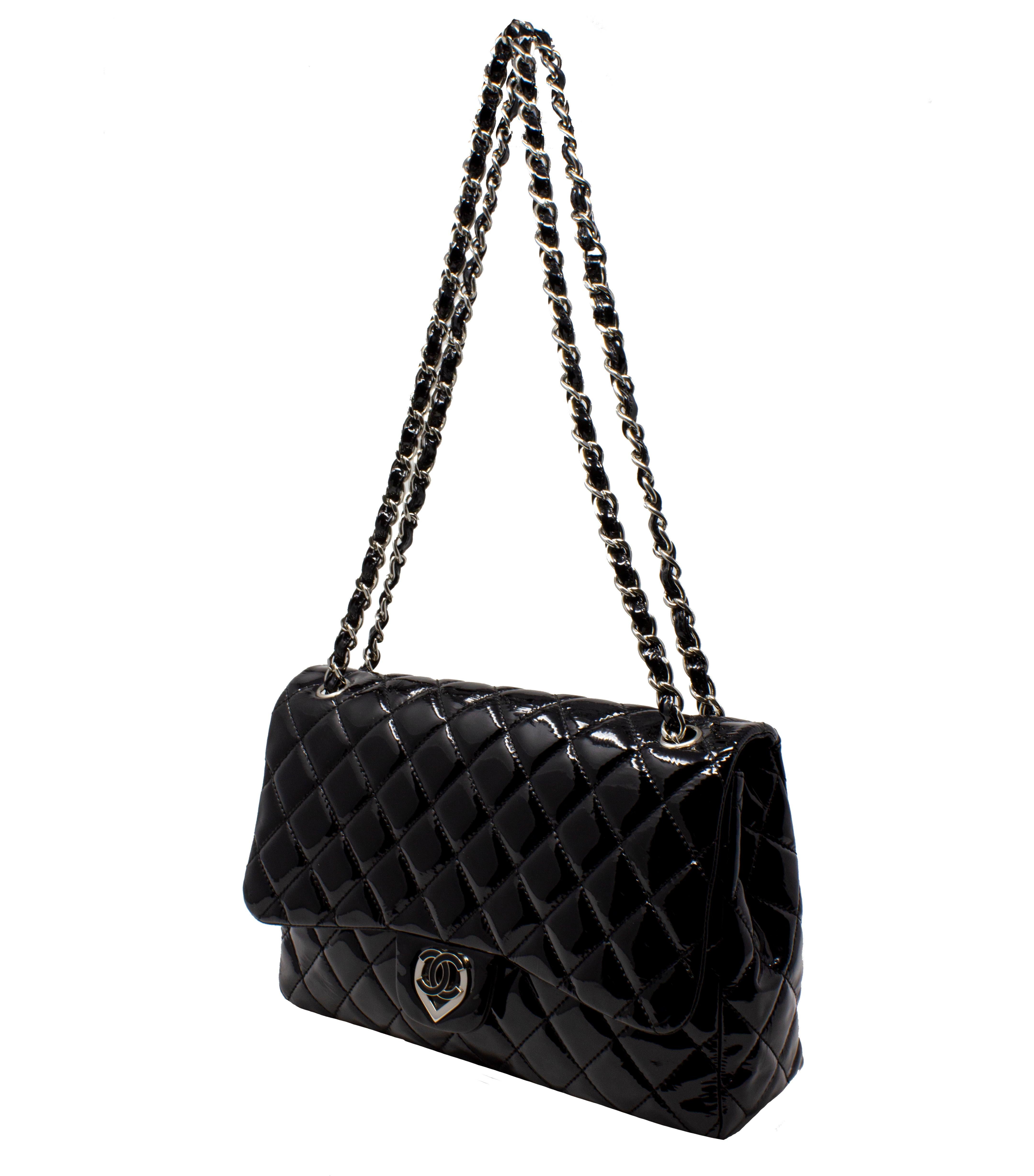 We LOVE this limited edition jumbo flap bag from 2008-2009! The hardware is unique and spirited and works perfectly with the patent leather.

Key features aside from the black patent leather and jumbo size? Rendered in silver hardware, features a