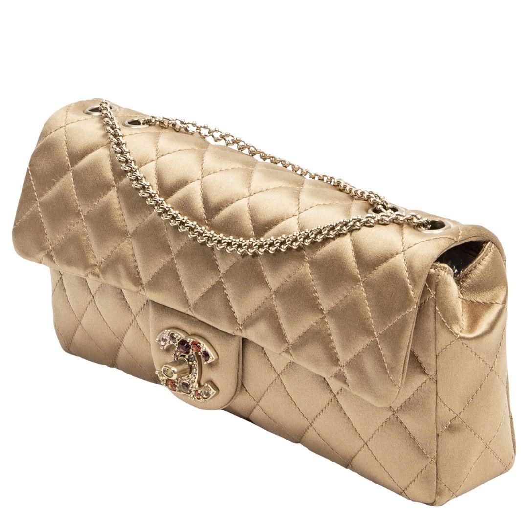 Bad and Chanel boujee produced between 2008-2009. I don't think you understand how rare this beauty is!!! This epic limited edition is crafted in gold quilted satin canvas, gold-tone hardware, a single exterior pocket to the back, and a double
