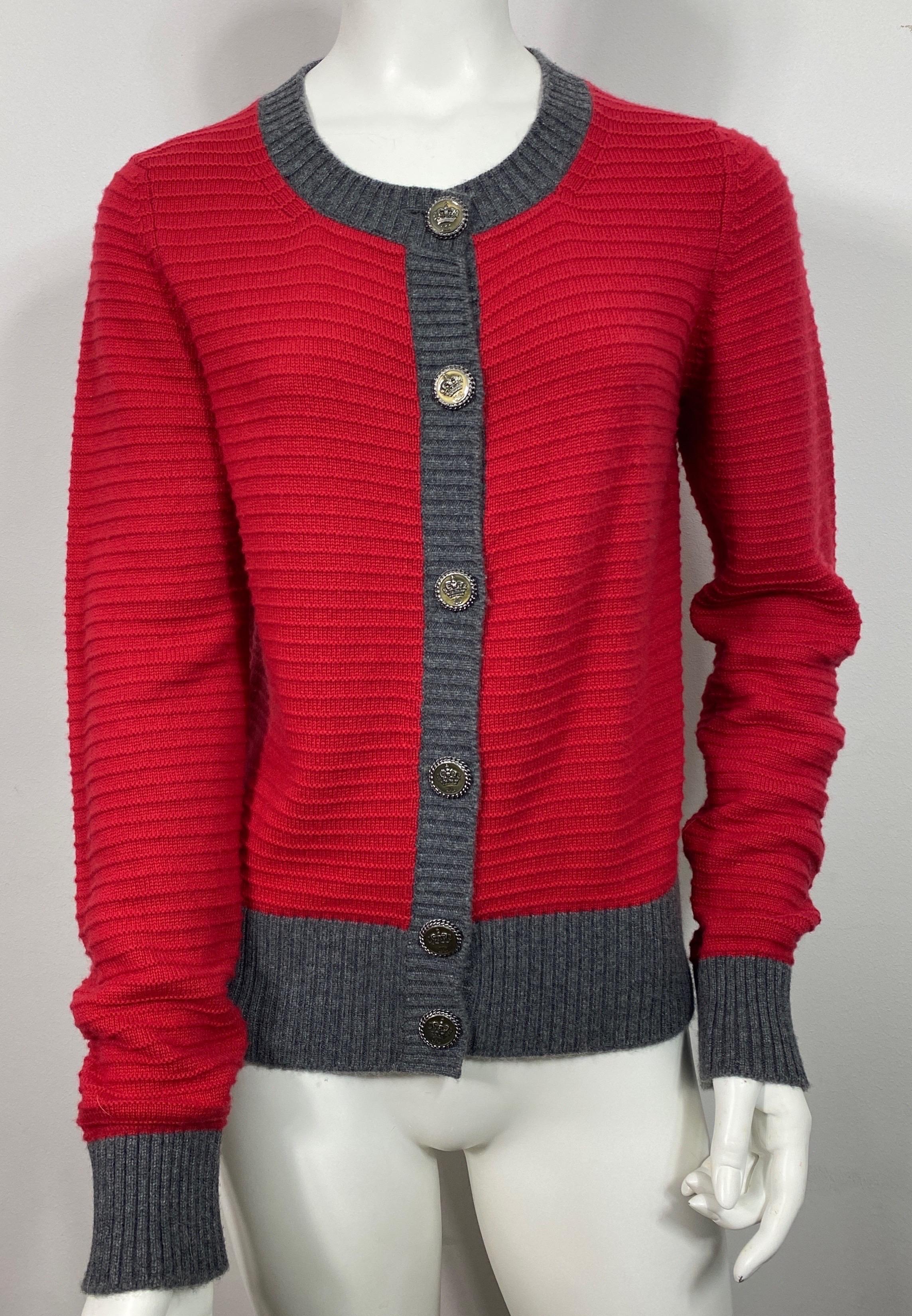 Chanel 2008A Red and Grey Ribbed Knit Cashmere Cardigan-Size 42 This very collectible Chanel ribbed knit cashmere is from the 2008 Autumn Collection by Karl Lagerfeld. The 100% cashmere cardigan has a ribbed like knit texture to it, the majority of