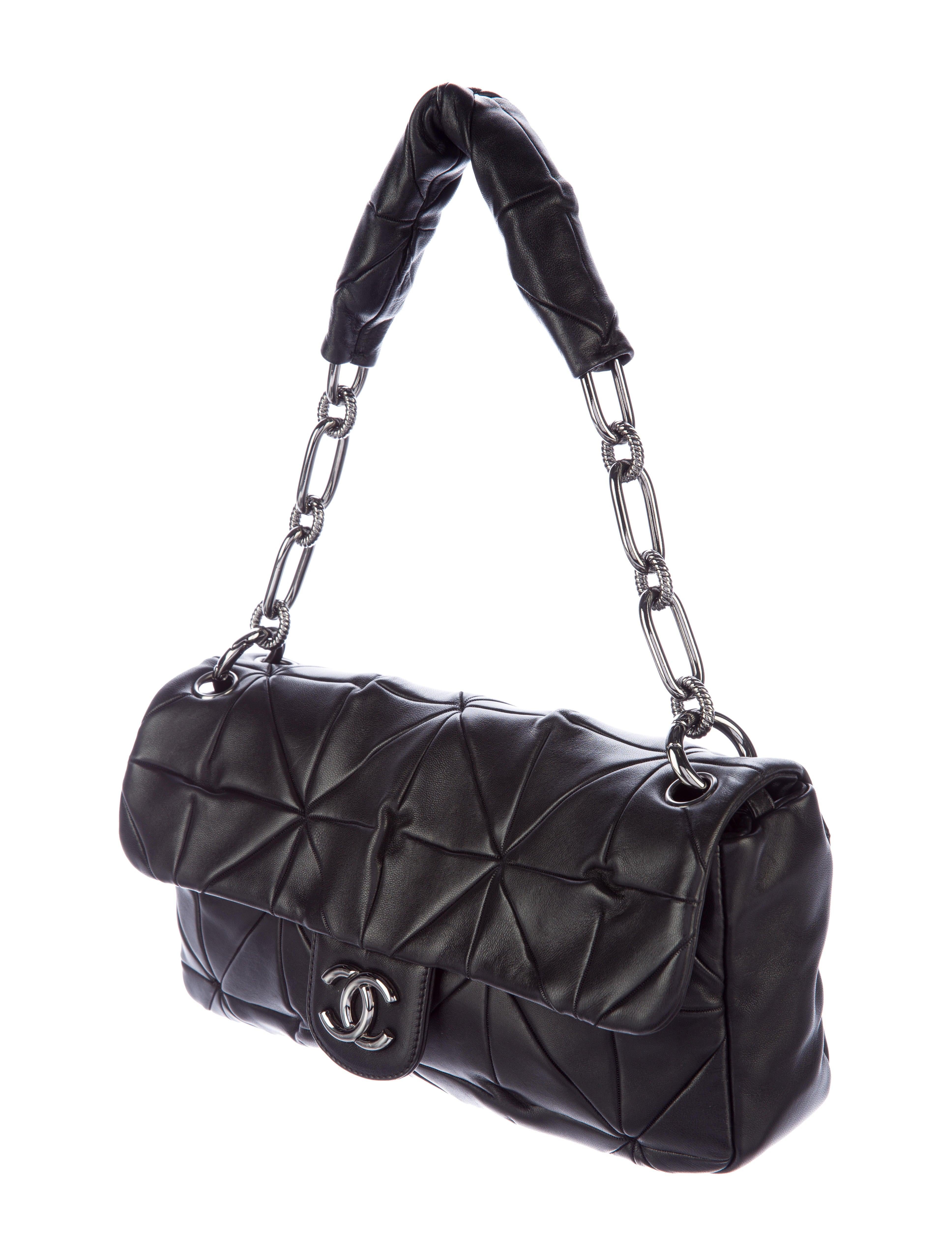 Chanel Jumbo Maxi Soft Lambskin Leather Classic Flap Shoulder Bag

Year: 2008-2009

Gunmetal hardware
Black quilted lambskin leather 
Logo at front with magnetic snap flap closure
Single chain-link and leather shoulder strap
Grey striped woven