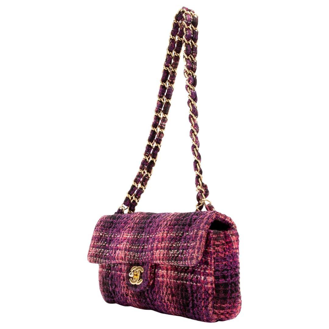 Super rare and classy vintage piece! Beautiful tweed East/West beauty in classy pink/purple/black hues. With complimentary gold-tone hardware, and double chain-link shoulder straps, the CC turn-lock opens up to a black leather interior with a single
