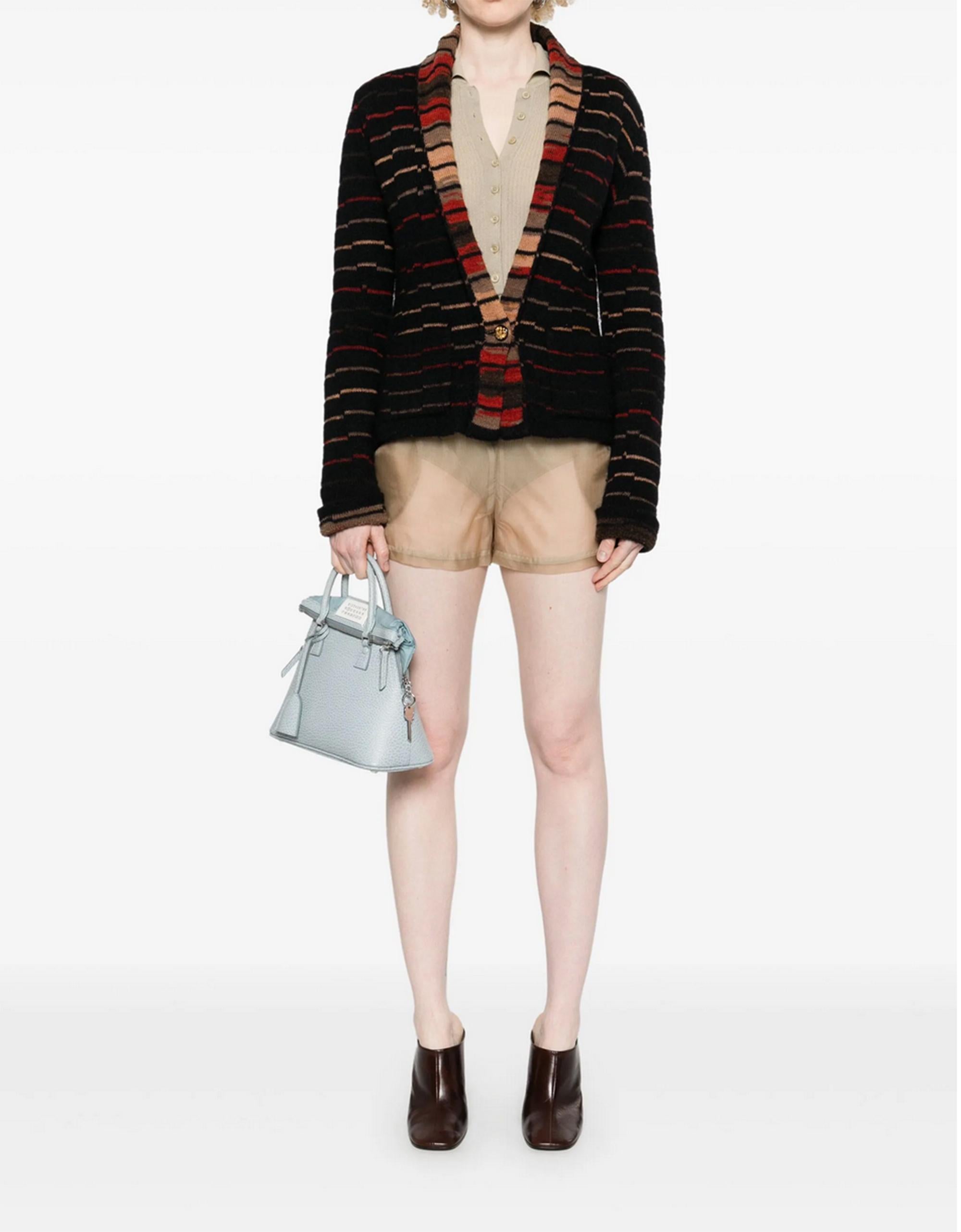 Chanel 2009 Paris-Moscow Striped cardigan featuring front logo buttons, patched pockets, shawl lapels.
Composition: Wool 60%, Mohair 25%, Paper 15%
Circa 2009 
Estimated size 40fr/US8/UK12
In good vintage condition.  Made in France.
We guarantee you