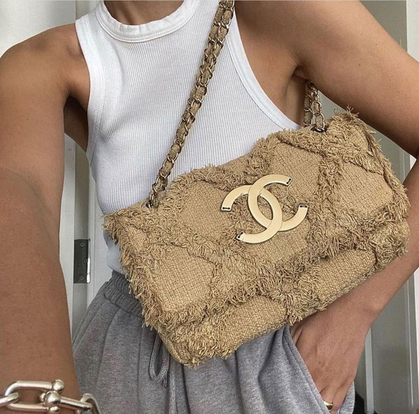 Chanel small sized beige nature tweed crochet flap

2009
Antique gold hardware
Large CC logo
Magnetic clasp closure
Interior beige canvas lining
Interior center zippered pocket
Flat bottom
6