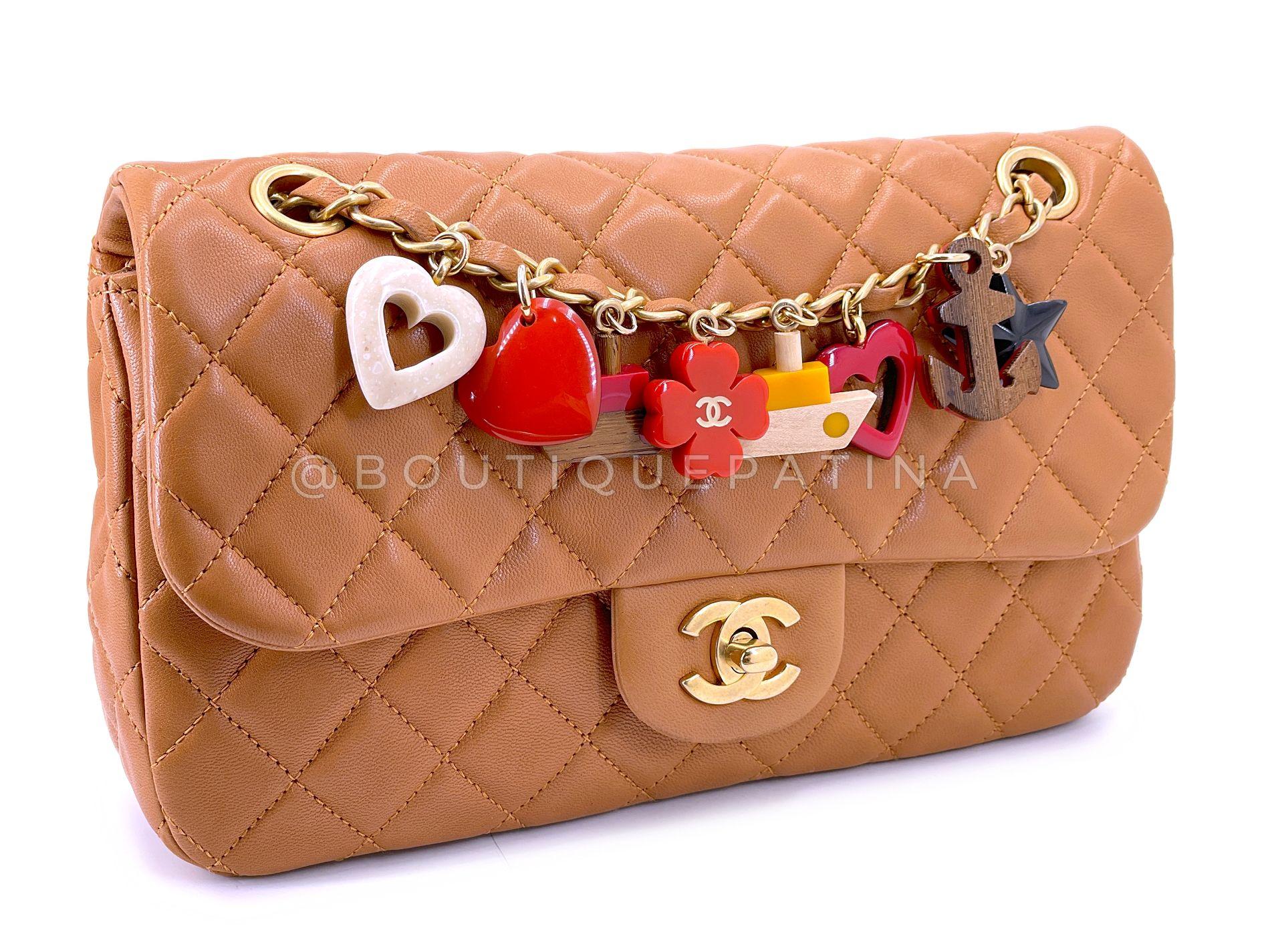 Store item: 68537
Limited in production, this whimsical flap is a twist on the Chanel Classic. In a beautiful beige lambskin and brushed gold hardware, the bag has a string of lucite and wooden charms that drape along one side of the chain.
Double
