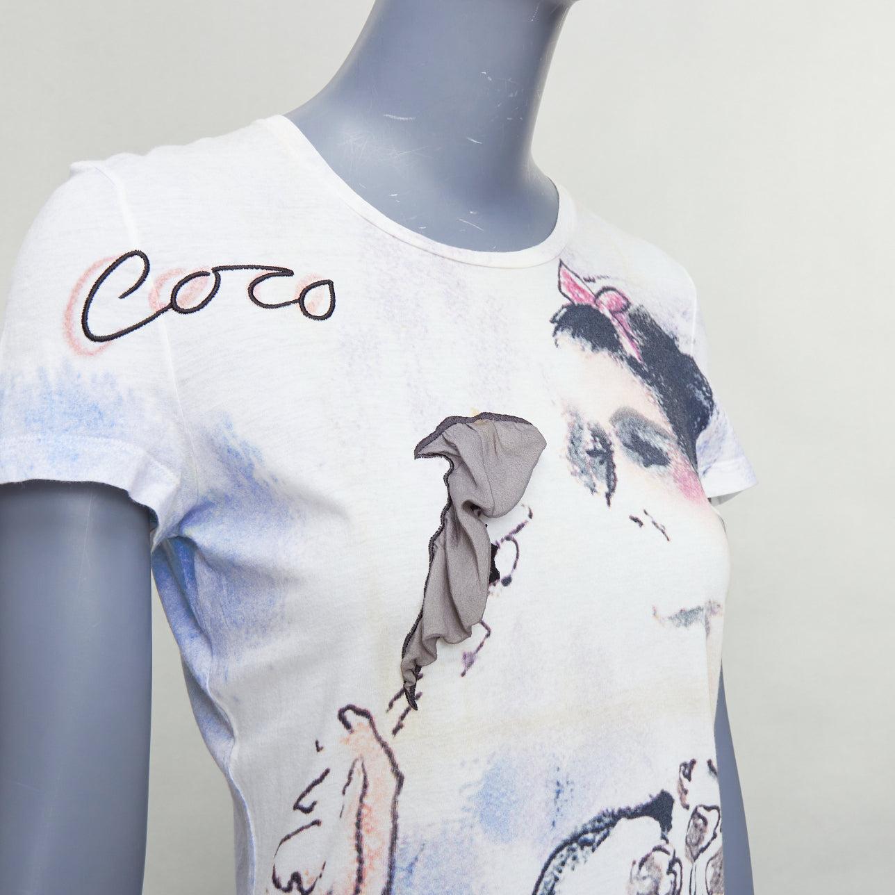 Chanel 2010 crema cotone Coco stampa acquerello seta tshirt FR36 S
Riferimento: LNKO/A02454
Marchio: Chanel
Designer: Karl Lagerfeld
Collezione: 2010
Materiale: Cotone, seta
Colore: Crema, Multicolore
Modello: Astratto
Chiusura: Slip On
Dettagli