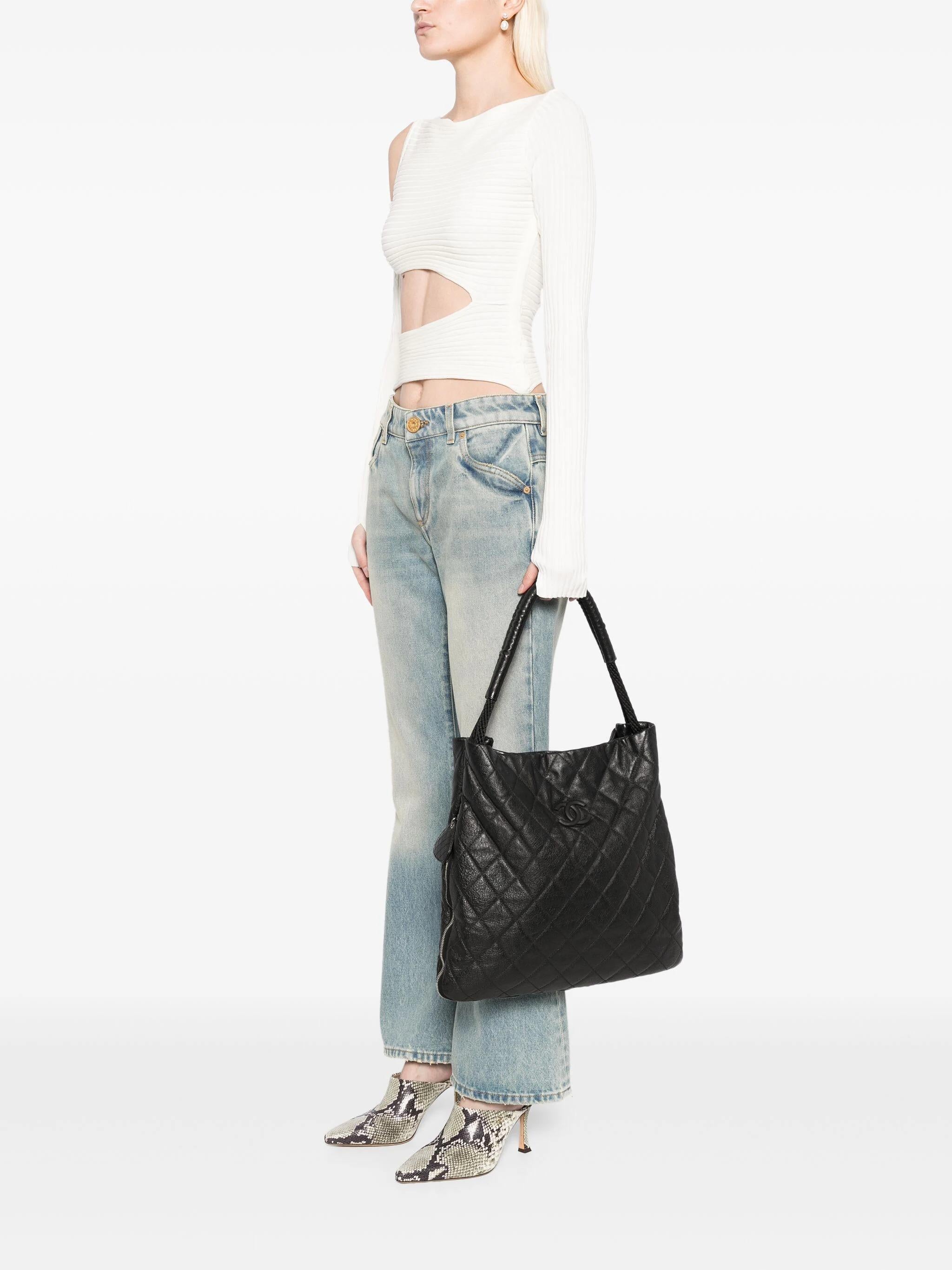 Chanel Large Boating Classic Shopper Zippered Expandable Hobo Tote Bag

Year: 2010
Large zip around boating tote
Silver hardware
Rubberized CC logo
Glazed boat rope handle
Canvas interior in burgundy
Interior center zippered pocket
Two additional