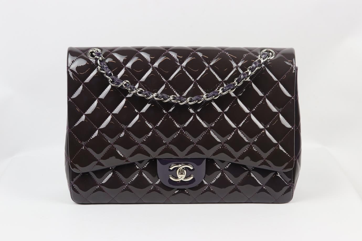 <ul>
<li>Chanel 2010 Maxi Classic quilted patent leather single flap shoulder bag.</li>
<li>Made from dark-purple quilted patent-leather with matching purple leather interior and silver-tone hardware and chain shoulder straps.</li>
<li>Dark