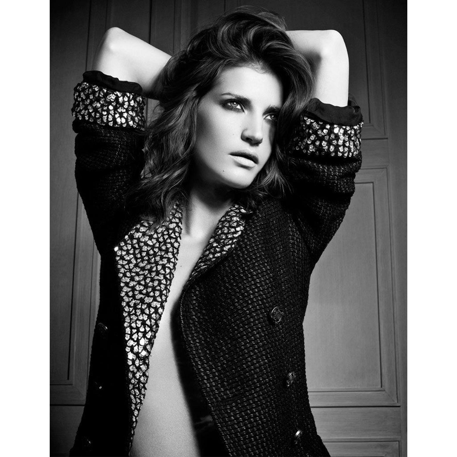 This is a fabulous double breasted Chanel pre-fall 2010 black silk wool blend  jacket with sequins. This runway collection was shown in Shanghai where Lagerfeld paid homage to its historical reputation of being the 