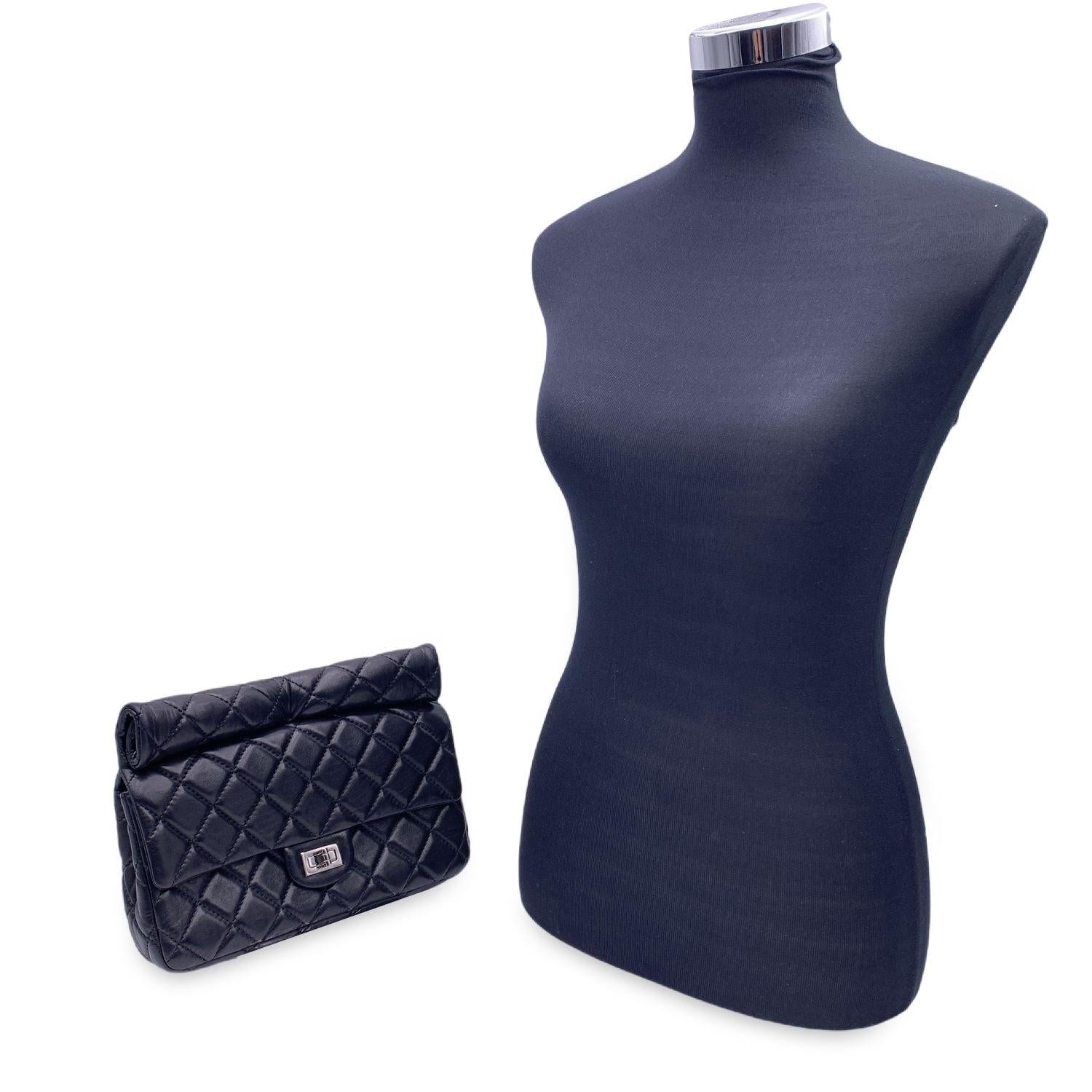 This beautiful Bag will come with a Certificate of Authenticity provided by Entrupy. The certificate will be provided at no further cost. Step into a world of timeless luxury with this stunning CHANEL Medium Roll 2.55 Reissue Clutch, a coveted piece