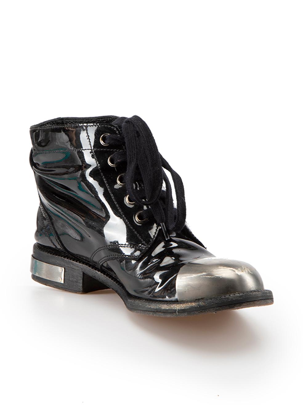 CONDITION is Good. Minor wear to boots is evident. Light wear to the boot uppers, heels and soles with abrasions and creasing to the leather. The metal hardware at the toes and heels are also scratched on this used Chanel designer resale item. These
