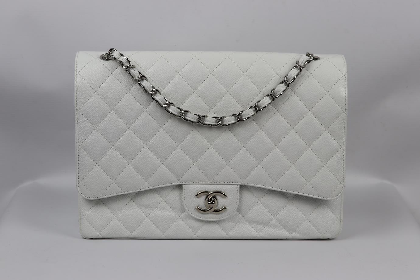 Chanel 2011 Maxi Classic quilted caviar leather double flap shoulder bag. Made from white caviar-leather with matching leather interior and palladium chain shoulder straps. White. Twist lock fastening at front. Does not come with authenticity card.