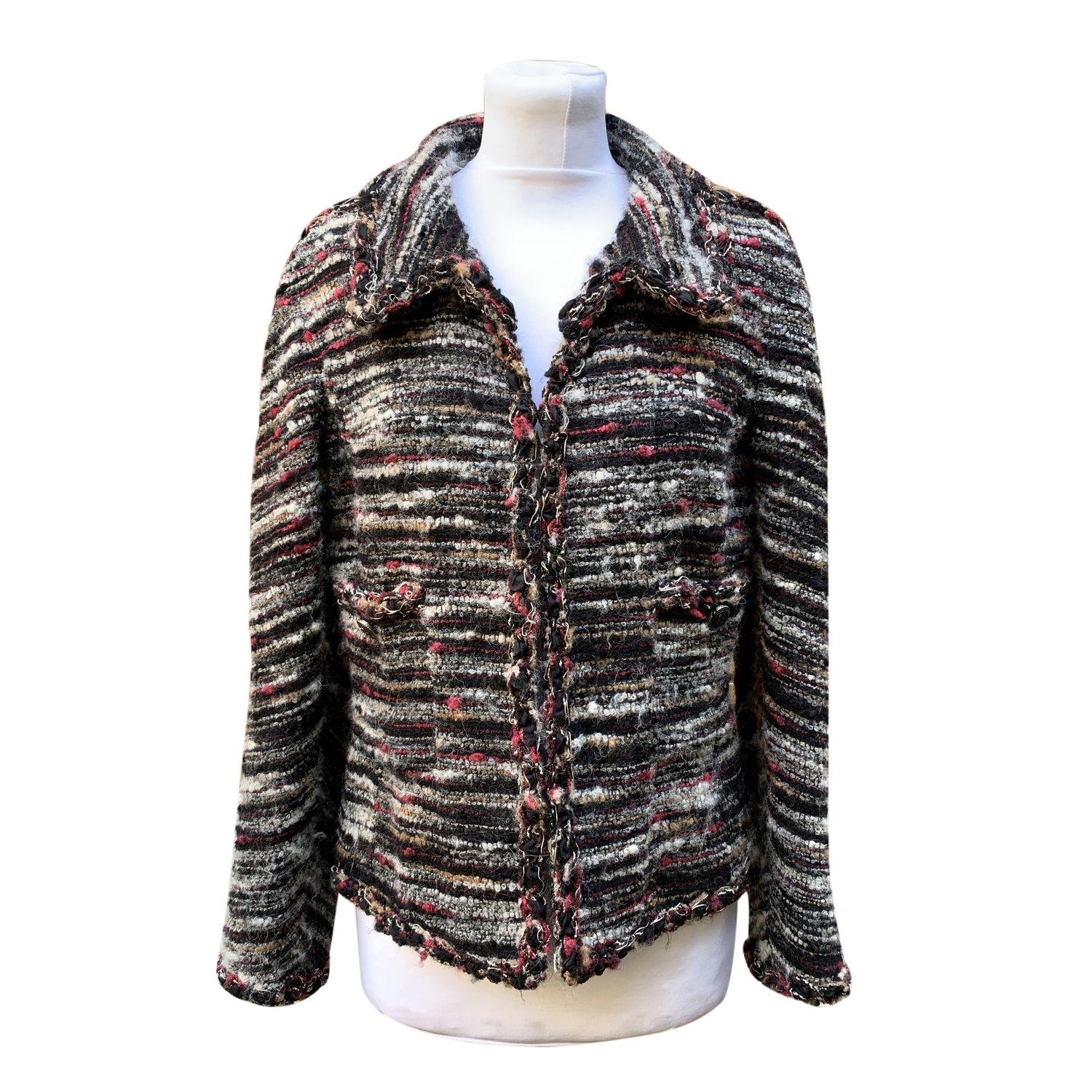 Chanel jacket cardigan Cardigan from the 2011 Fall/Winter 'Paris - Byzance' Collection. Black with multicolored bouclé pattern. Single hook and eye closure. 2 front pockets with CC logo buttons. Signature chain along the hem. Made in France.