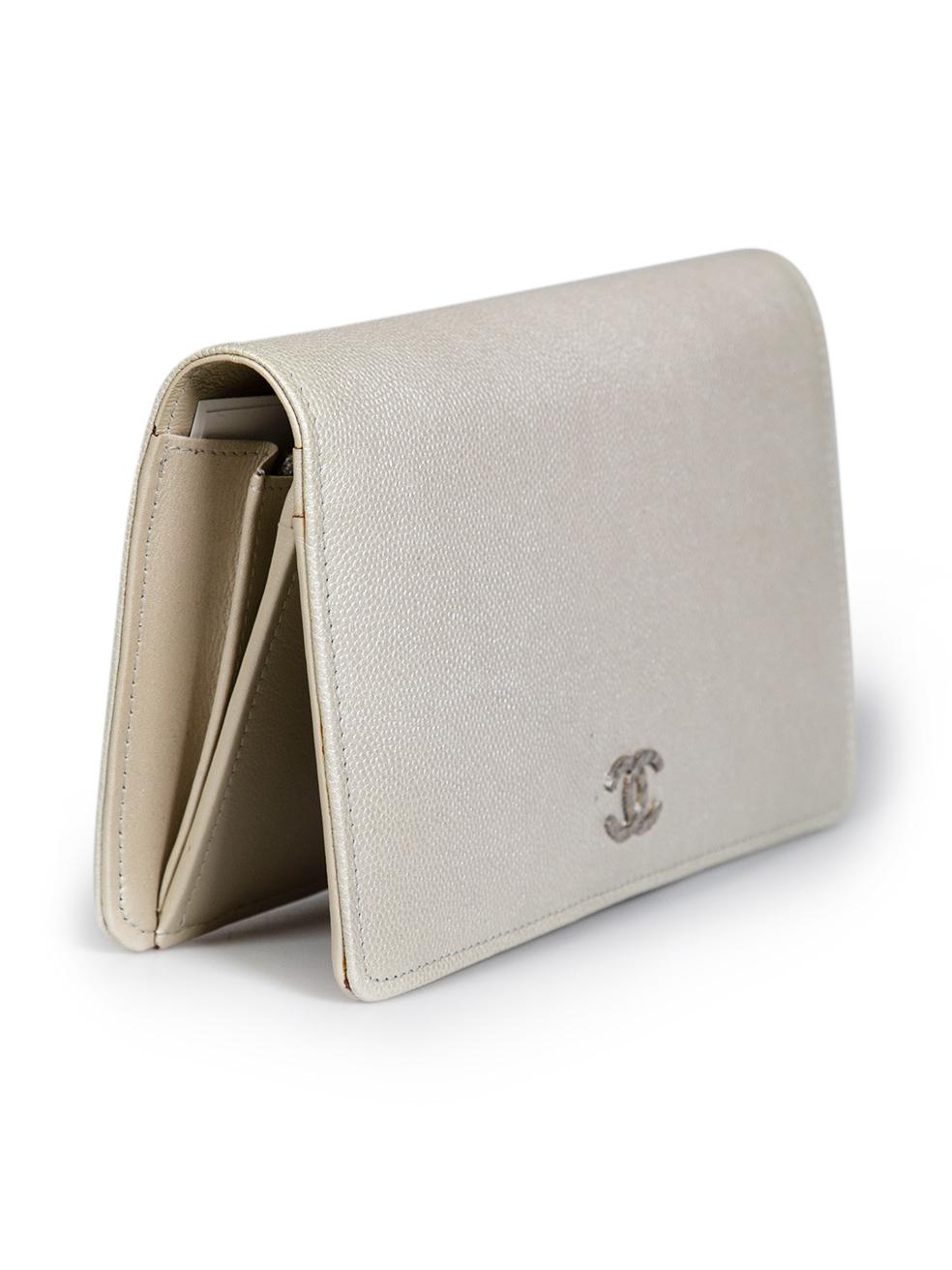 CONDITION is Very good. Minor discolouration to the leather exterior on the front near the hardware on this used Chanel designer resale item. This item comes with original box.
 
 Details
 2011
 Silver
 Caviar leather
 Bi fold wallet
 Front CC logo