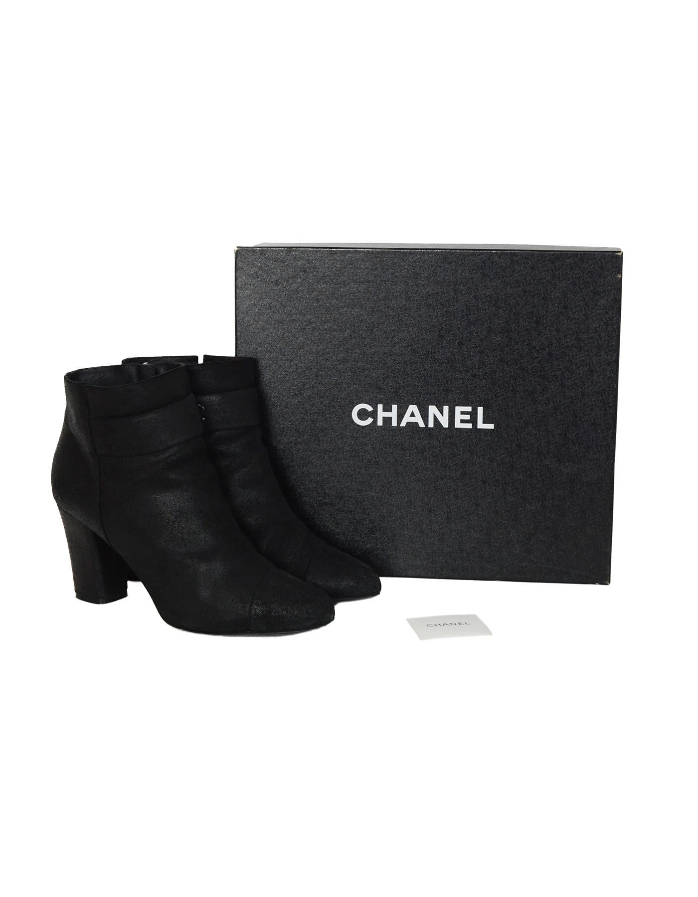 Chanel 2012 Black Suede Heeled Booties W/ CC Sz 42

Made In: Italy
Year of Production: 2012
Color: Black
Hardware: Silvertone, black
Materials: Sueded leather 
Closure/Opening: Side zipper
Overall Condition: Excellent pre-owned condition with