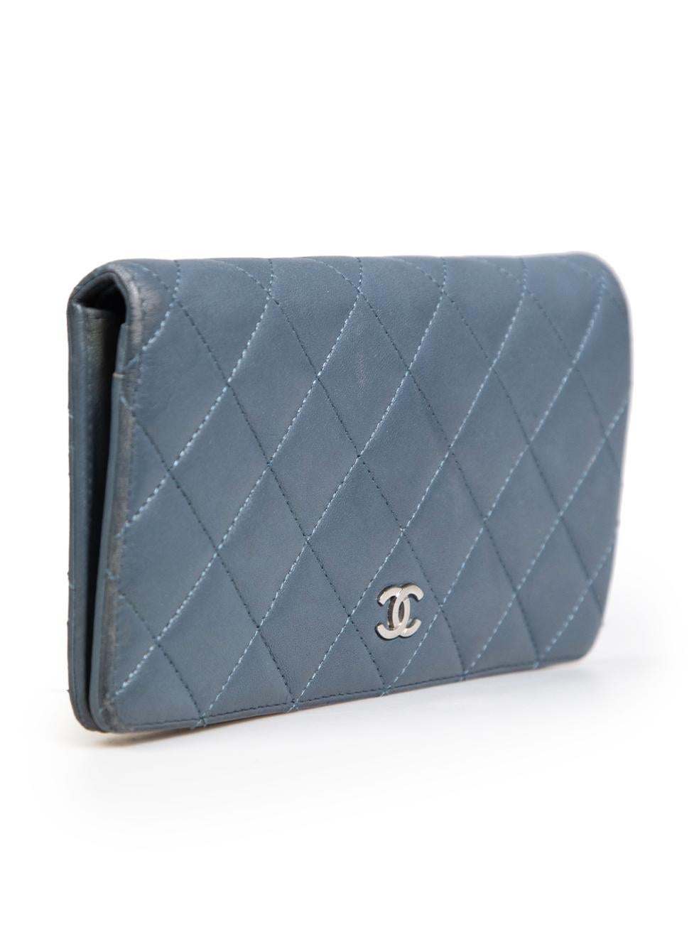 CONDITION is Good. General wear to wallet is evident. Moderate signs of wear to the corners. Light discolouration to the leather on the interior, corners and pockets. Light marks near the pockets on the inside on this used Chanel designer resale
