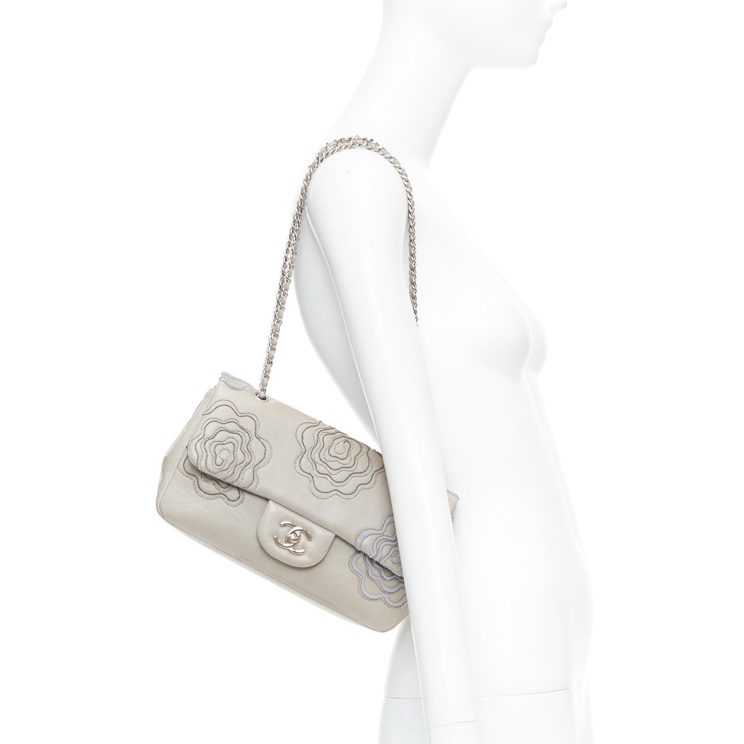 CHANEL 2012 Camellia Follies Ricamata grey leather CC classic flap bag
Reference: JHDN/A00006
Brand: Chanel
Designer: Karl Lagerfeld
Model: Camellia Follies Ricamata
Collection: 2012 SS
Material: Leather
Color: Grey, Silver
Pattern: Floral
Closure: