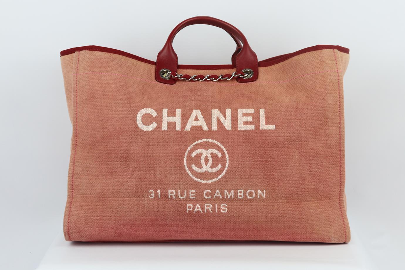 Chanel 2012 Deauville extra large canvas and leather tote bag. Made in Italy, this beautiful 2012 Chanel extra large ‘Deauville’ tote bag has been made from dusty-pink canvas exterior with matching burgundy interior, this piece is decorated with a