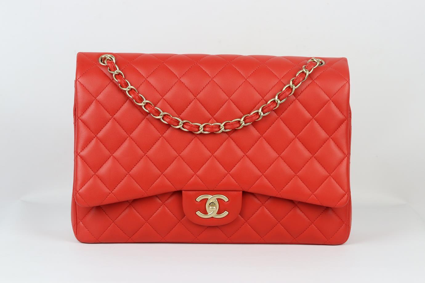Chanel 2012 Maxi Classic quilted leather double flap shoulder bag. Made from red quilted leather with matching red leather interior and antiqued gold-tone hardware and chain shoulder straps. Red. Twist lock fastening at front. Does not come with