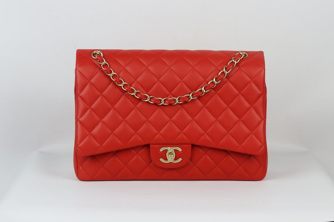 <ul>
<li>Chanel 2012 Maxi Classic quilted leather double flap shoulder bag.</li>
<li>Made from red quilted leather with matching red leather interior and antiqued gold-tone hardware and chain shoulder straps.</li>
<li>Red.</li>
<li>Twist lock