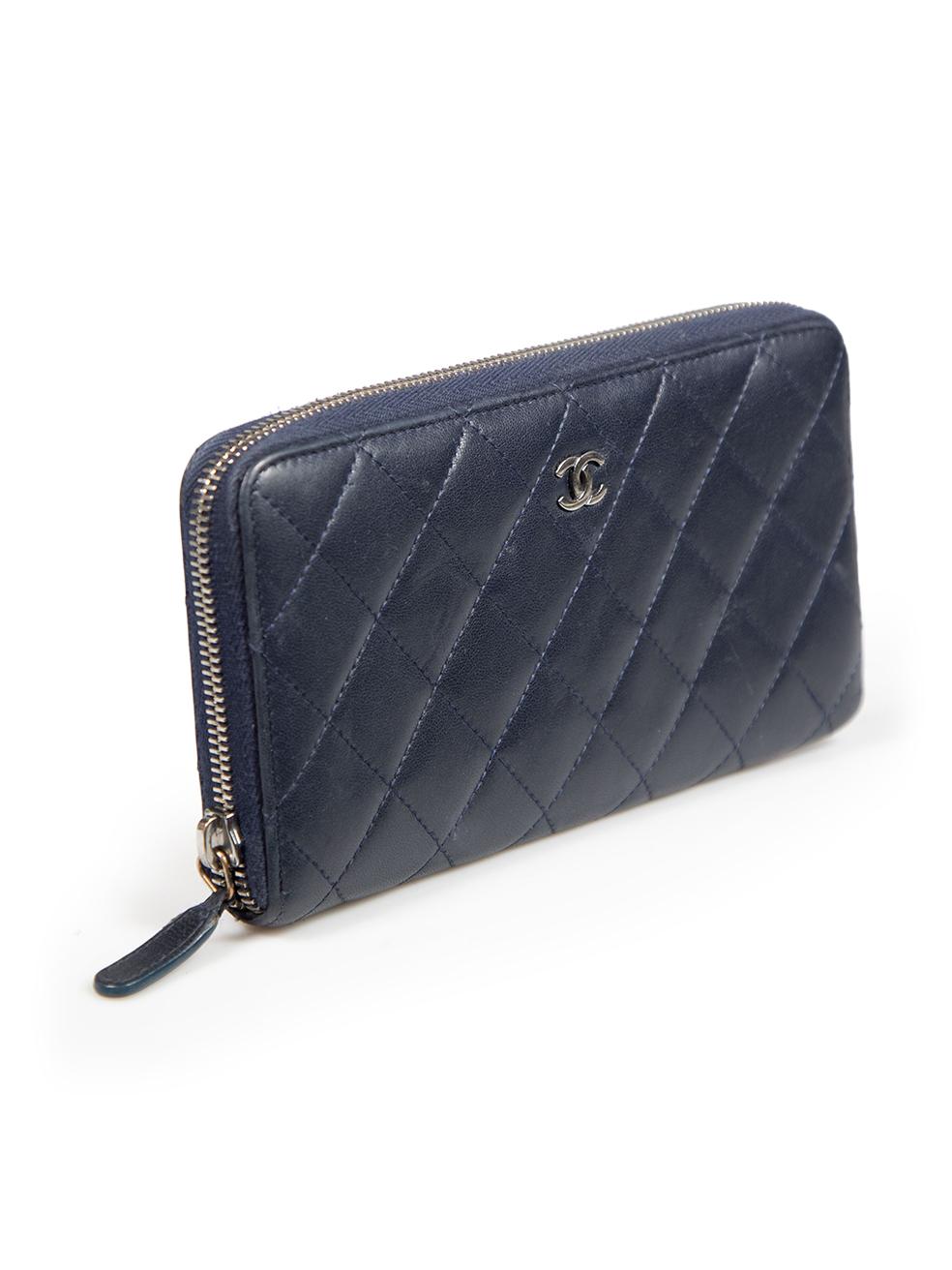 CONDITION is Good. Minor wear to the wallet is evident. Light wear to the front is seen with abrasion marks all over, especially in the front, brand logo, back and sides with a few discolouration marks on the internal lining of this used Chanel