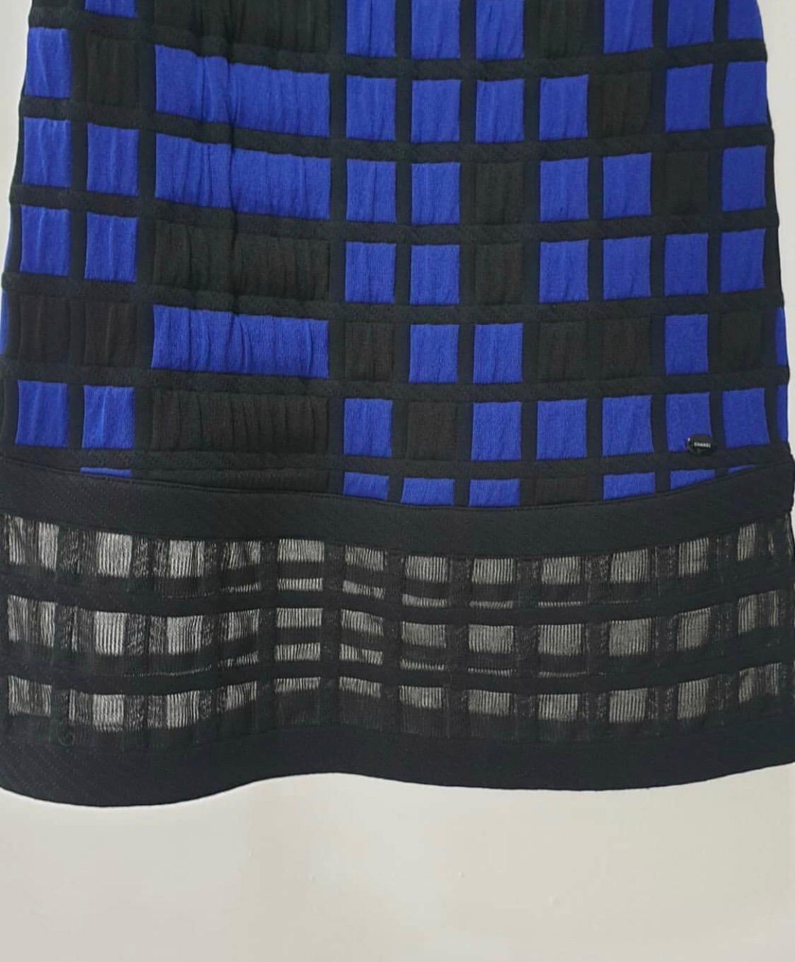 From the  cruise 2013 runway collection

Excellent condition.

Features a blue and black checkered geometric pattern with mash checkering at the hem. Elastic around bust. Side zipper with hook & eye fastening. 

Size 38 
roughly size 4-6 US. 

For