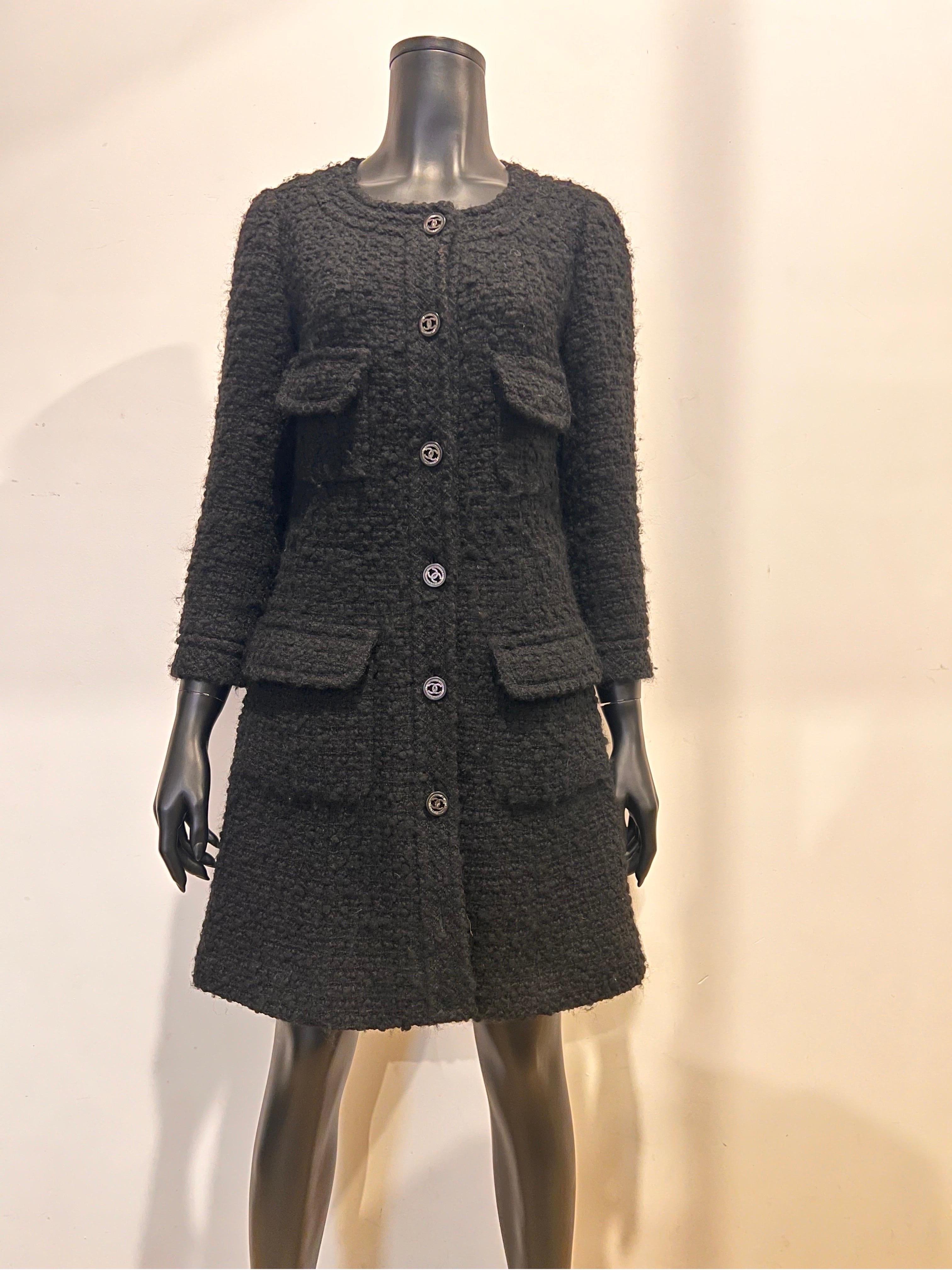 Classic archive Chanel boucle tweed coat dress in black with double C buttons. From the Karl Largefeld era. 2013 Collection.
Size 38. Fully lined and in great condition. 
Model P46625