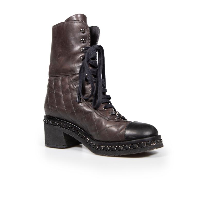 CONDITION is Good. Minor wear to the boots is evident. Light signs of wear to the boots are seen with overall abrasion marks especially front and leg up. The brand logo on the right side of the right boot is missing on this used Chanel designer