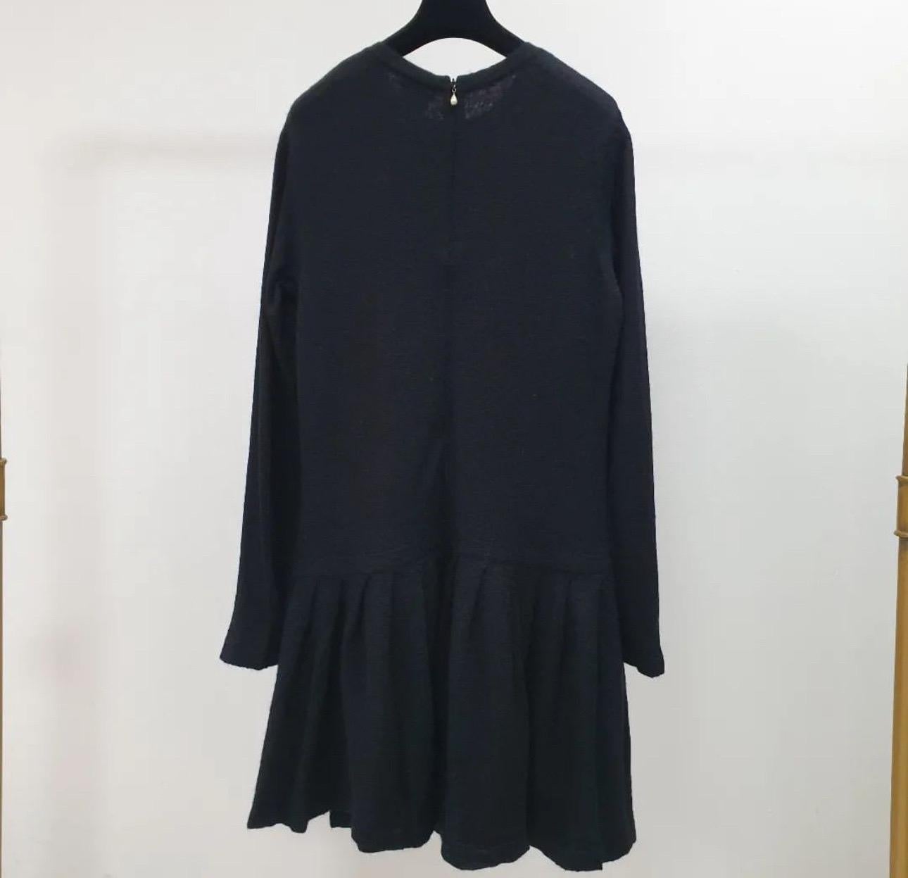 Est. Retail Price of $3,200.00

Description

        Chanel Mohair A-Line Dress
        From the Pre-Fall 2014 Collection by Karl Lagerfeld
        Black
        Interlocking CC Logo & Faux Pearl Accents
        Studded Accents
        Three-Quarter