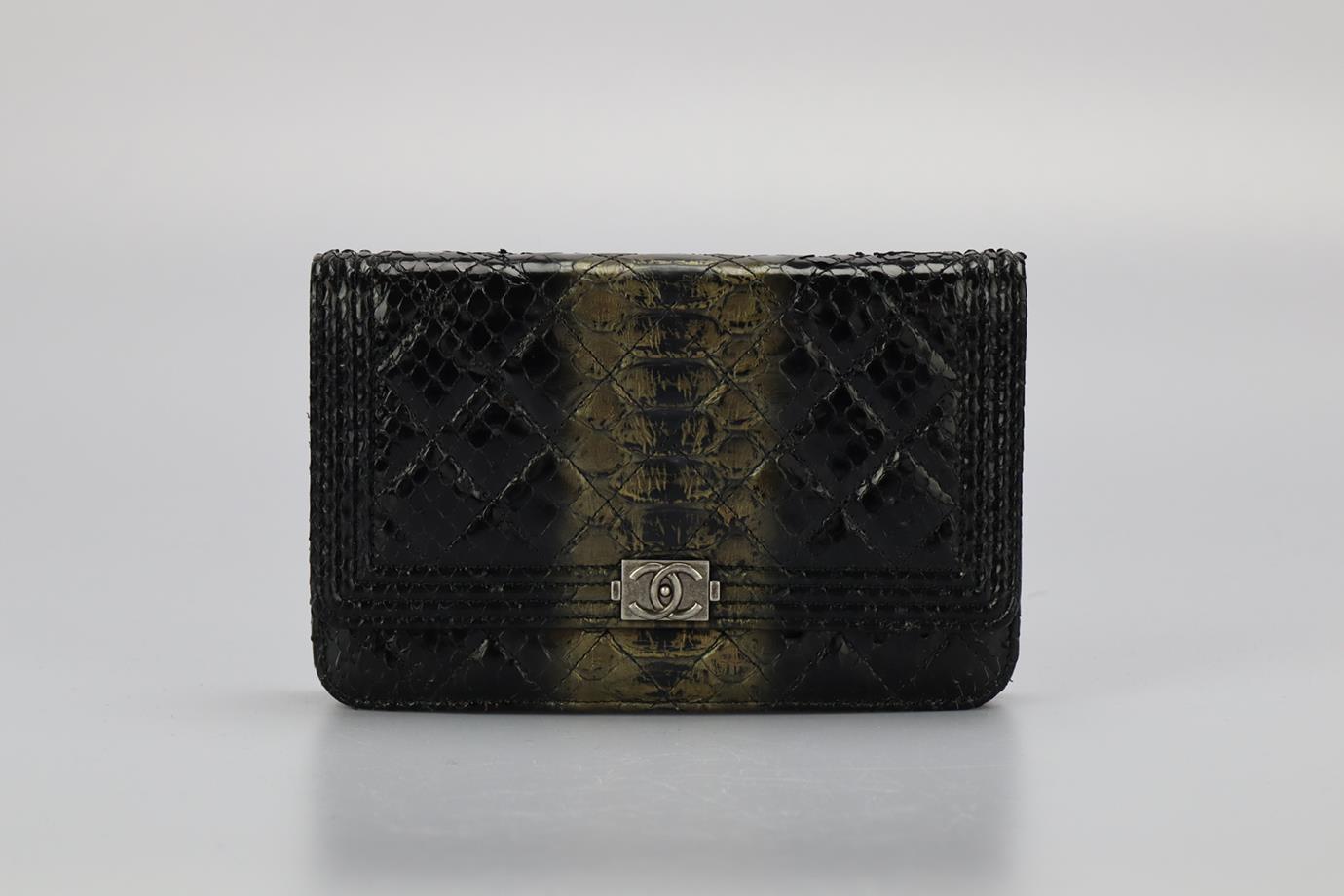 Chanel 2014 Boy Wallet On Chain Quilted Python Shoulder Bag. Black and bronze. Snap button fastening - Front. Comes with - authenticity card. Does not come with - dustbag or box. Height: 15 in. Width: 7.6 in. Depth: 1 in. Strap drop: 14.9 in.