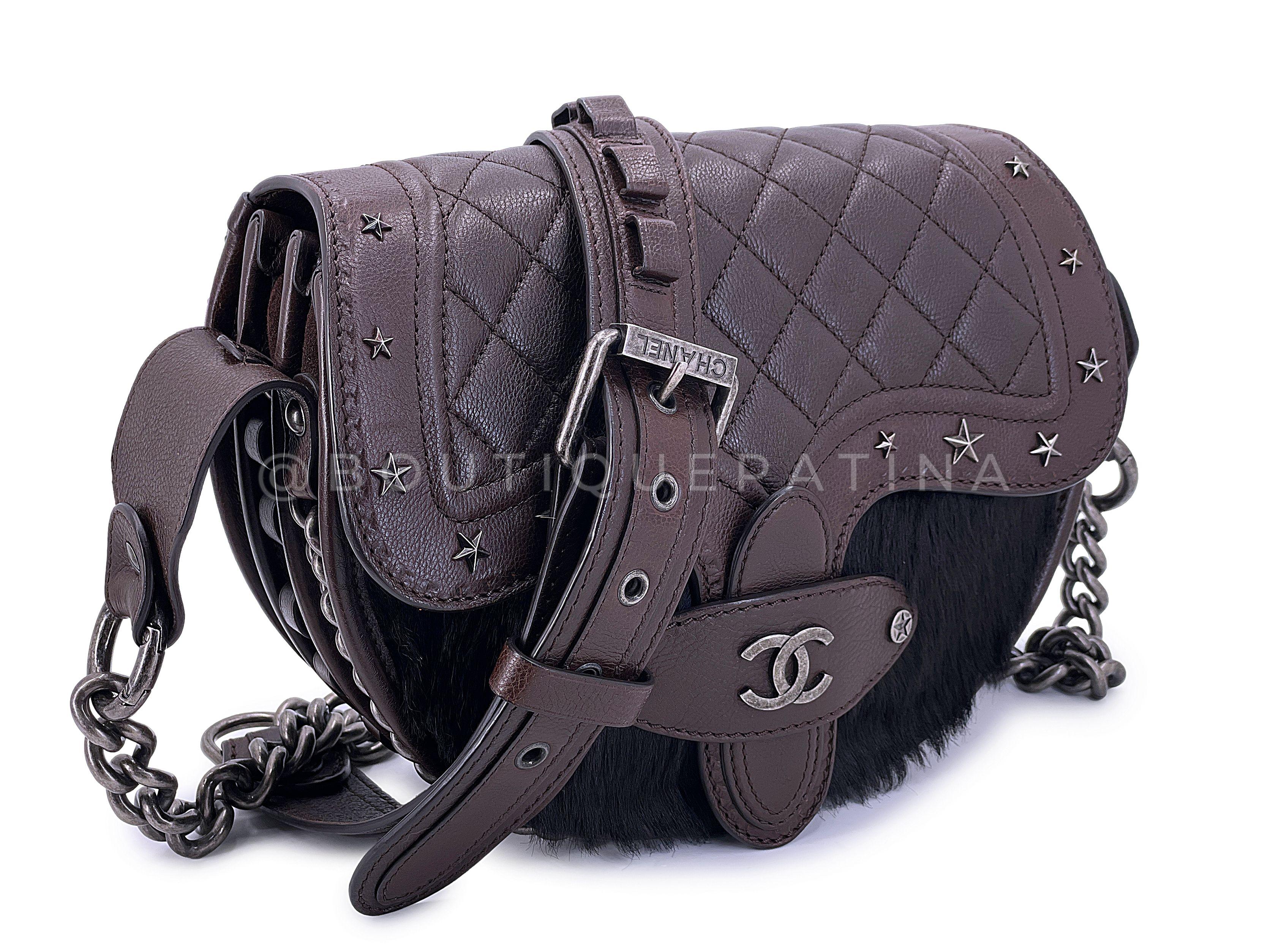 Store item: 67762
Chanel 2014 Paris Dallas Métiers d'Art Brown Pony Hair Crossbody Bullet Strap Bag RHW from Karl Lagerfeld's Paris-Dallas collection is a collectible piece.

Made of brown grained quilted leather and black pony hair on front, the