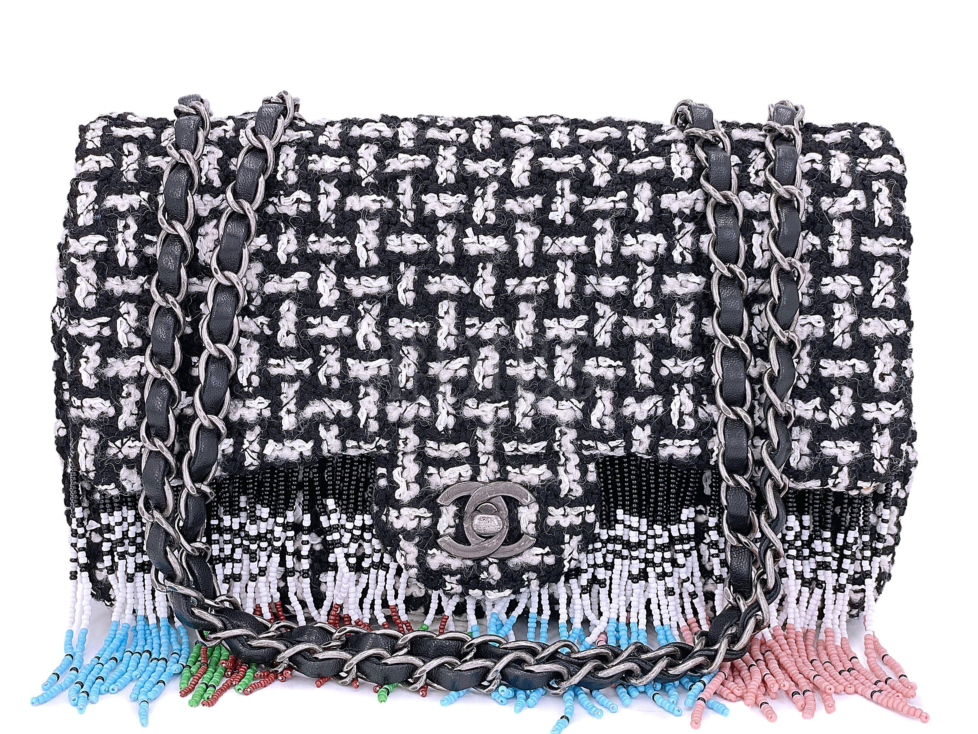 Store item: 67934
This Chanel 2014 Paris-Dallas Métiers d'Art Tweed Beaded Fringe Flap Bag RHW is a very rare collectible from Karl's 2014 prefall Métiers d'Art runway themed Paris Dallas.

For 20 years, Boutique Patina has specialized in sourcing