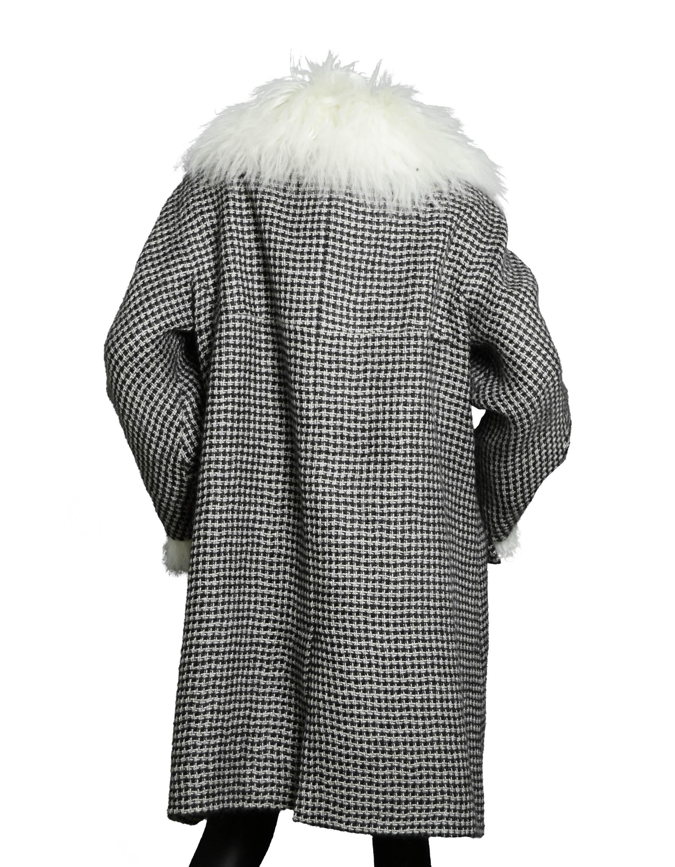 Chanel 2014 Paris-Dallas Mohair Coat W/Detachable Shearling Cuffs & Collar

Made In: France
Year of Production: 2014
Color: Black & white tweed
Materials: 100% Mohair
Lining: 100% Silk
Opening/Closure: Button up
Overall Condition: