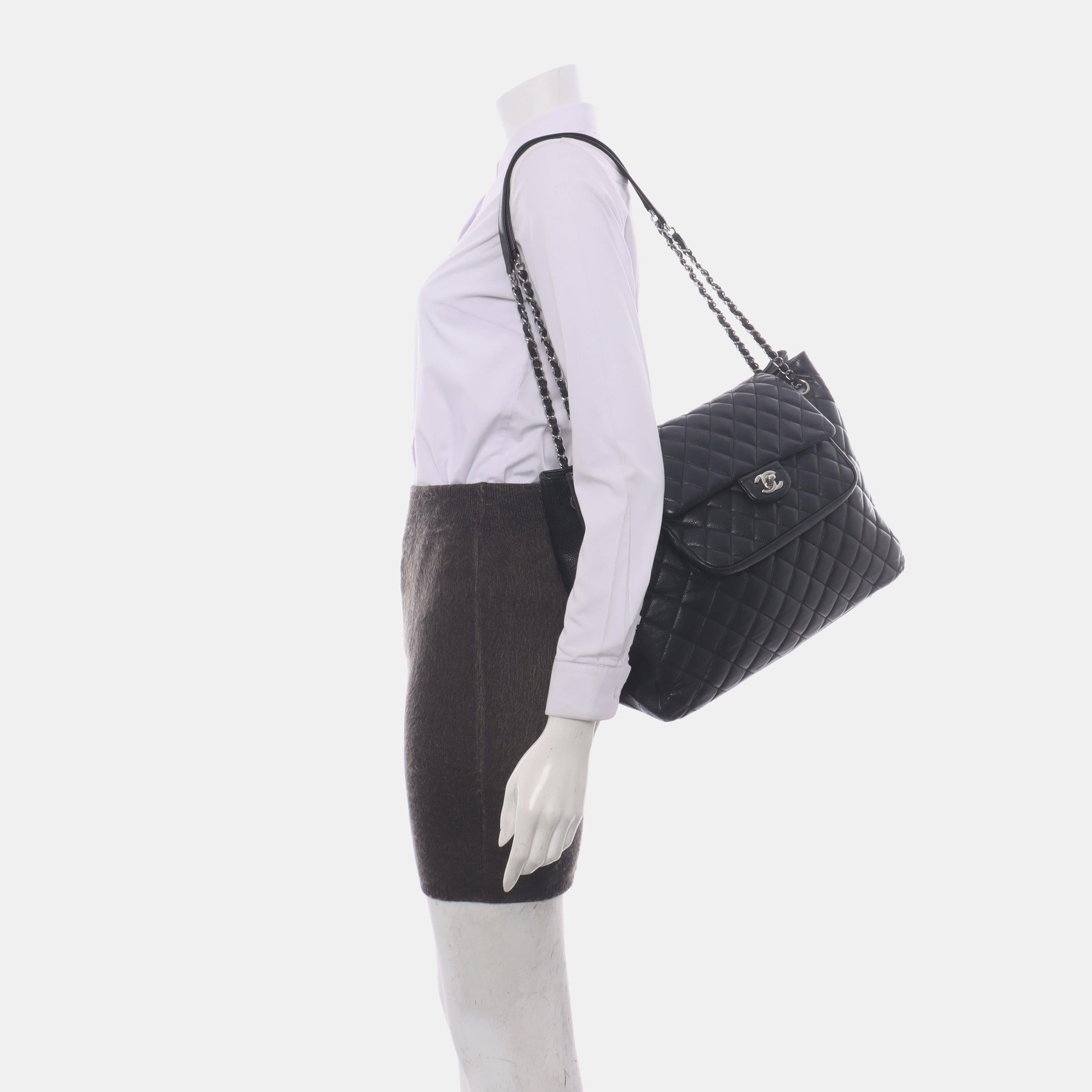 Chanel 2014 Paris-Edinburgh Flap Tote Bag Black Caviar Leather
 These are professional photos of the actual bag.
 Exceptionally clever, this tote bag has a flap bag on top of it. A fun and practical design. 
 CONDITION: VERY GOOD.
 This previously