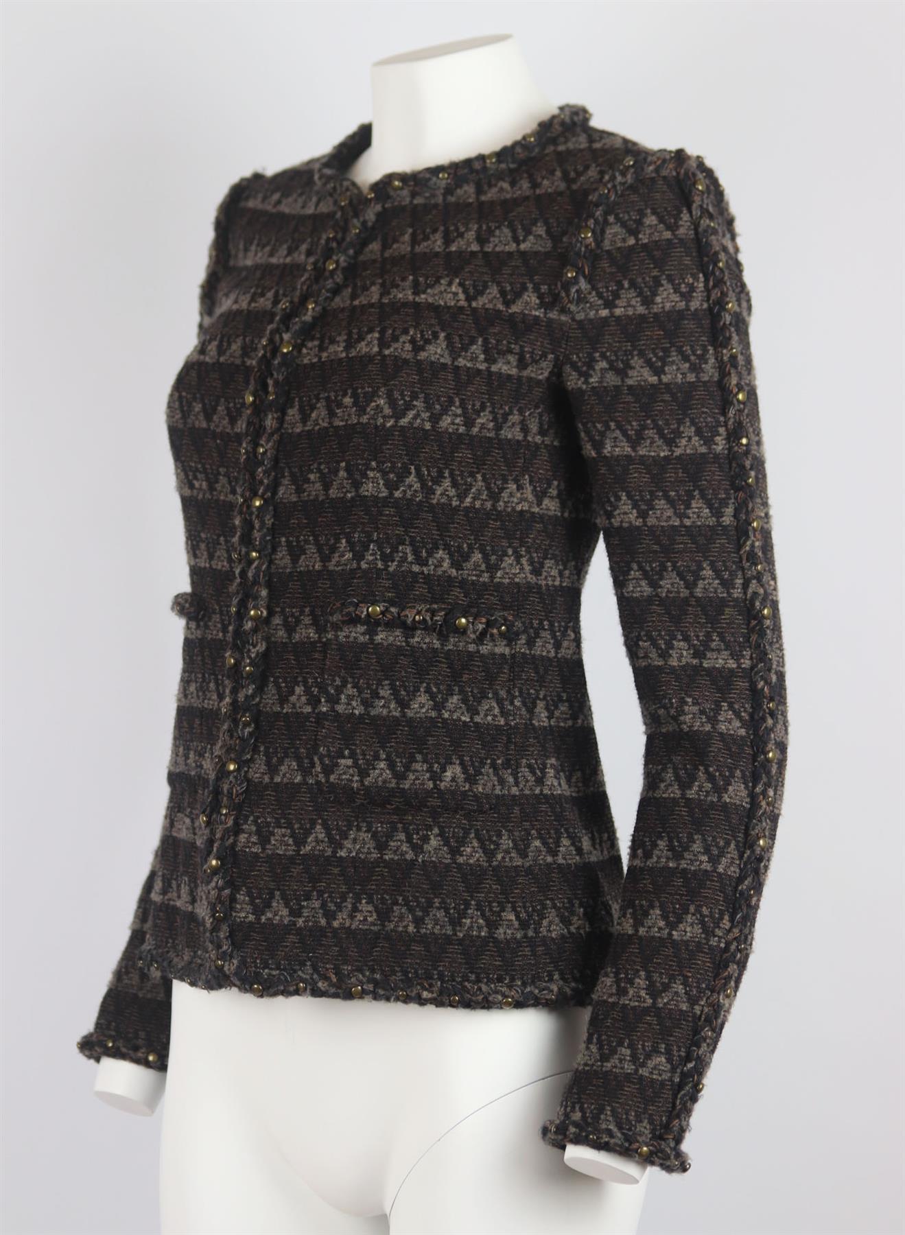 Part of Pre-Fall 2014, this Chanel jacket has been made from tactile wool-blend tweed that's woven with the brand's signature multi-layered textures and colours, it's designed for a slim fit and has antiqued-bronzed studded detail and silk lining